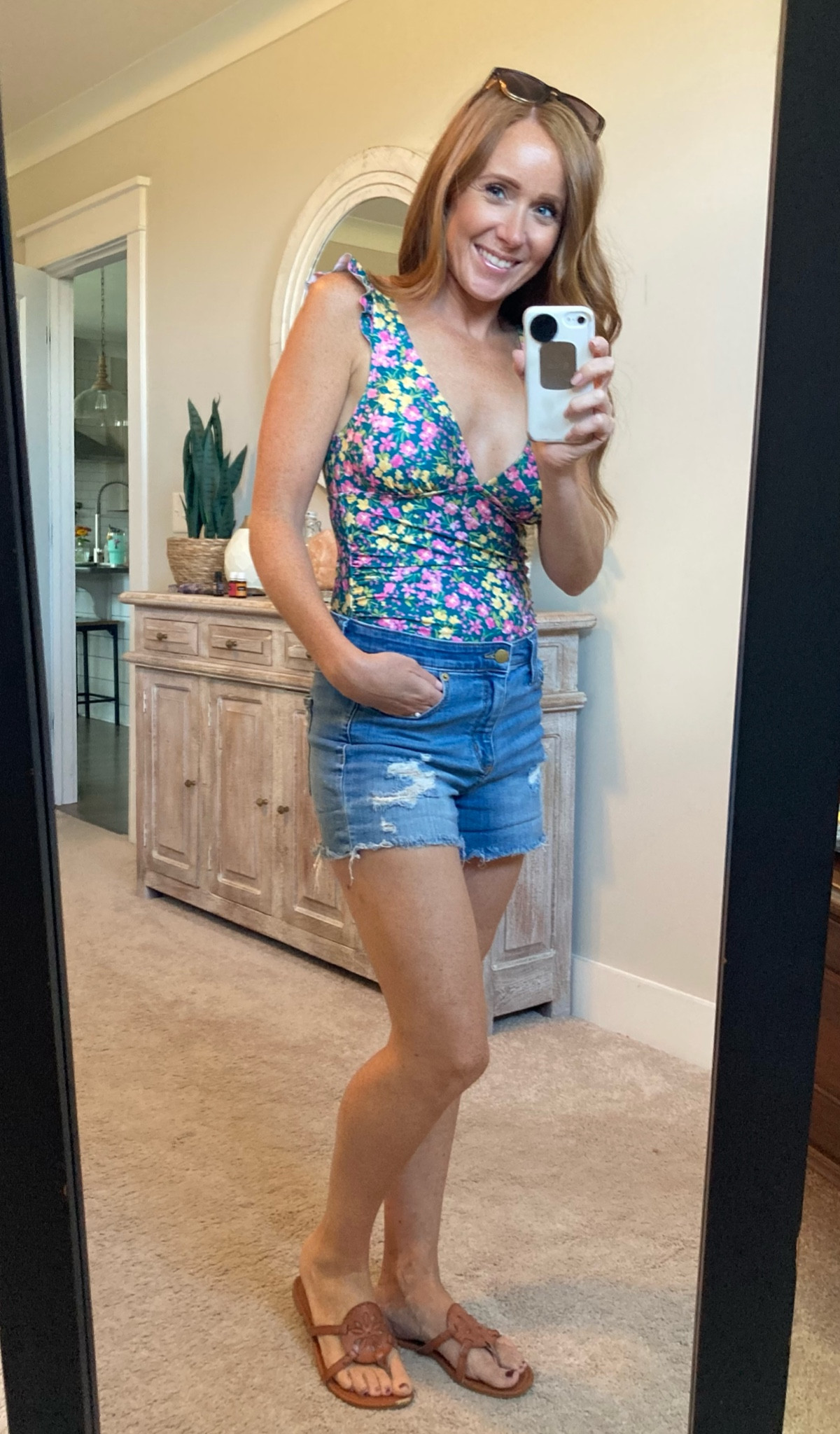 The colors in this suit are gorgeous, and it is the perfect suit for a Mom who wants to be comfy. 
Regular straps are very comfortable, I don’t love halter suits, hurts my neck.
Has ruching on the front which makes it very flattering.
The back has full coverage, so you do t have to worry about picking at your bum all day.
It pairs so cute with shorts too! 
Both run true to size.

#LTKStyleTip #LTKSwim #LTKSeasonal