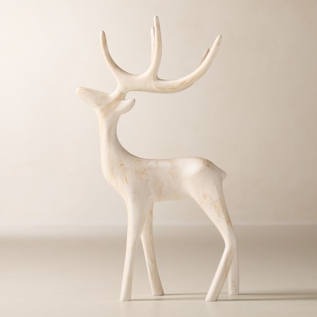 A large white cement reindeer