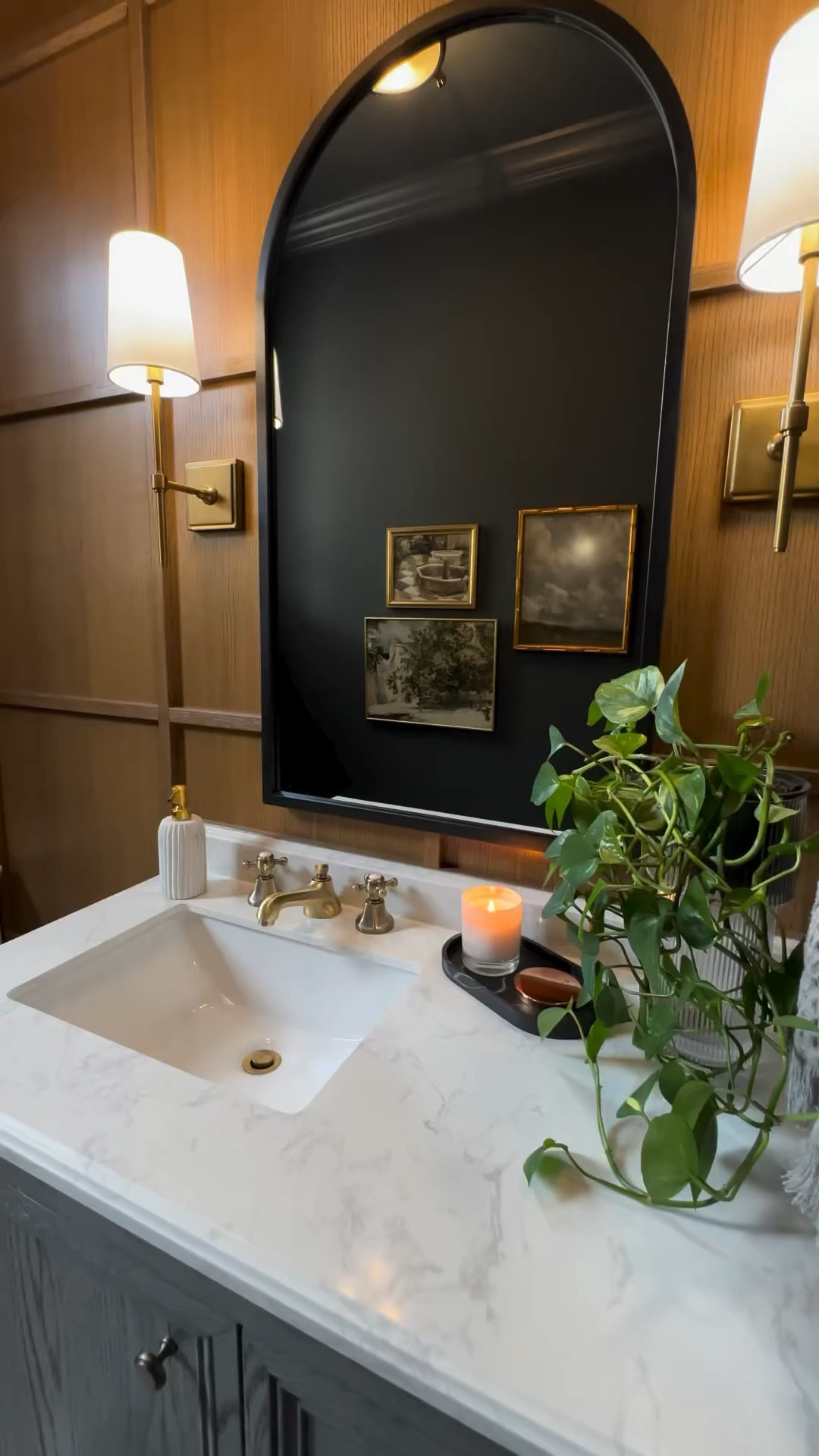 Home decor • gallery wall • brass gallery wall • wall mounted picture frames • bathroom decorations • dark walls • saturated room • bathroom inspo • 

#LTKhome