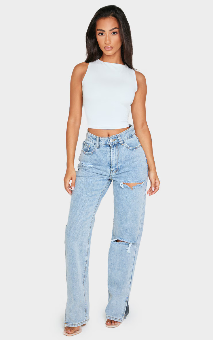 Petite Bleach Wash Ripped Split Hem Jeans | PrettyLittleThing US