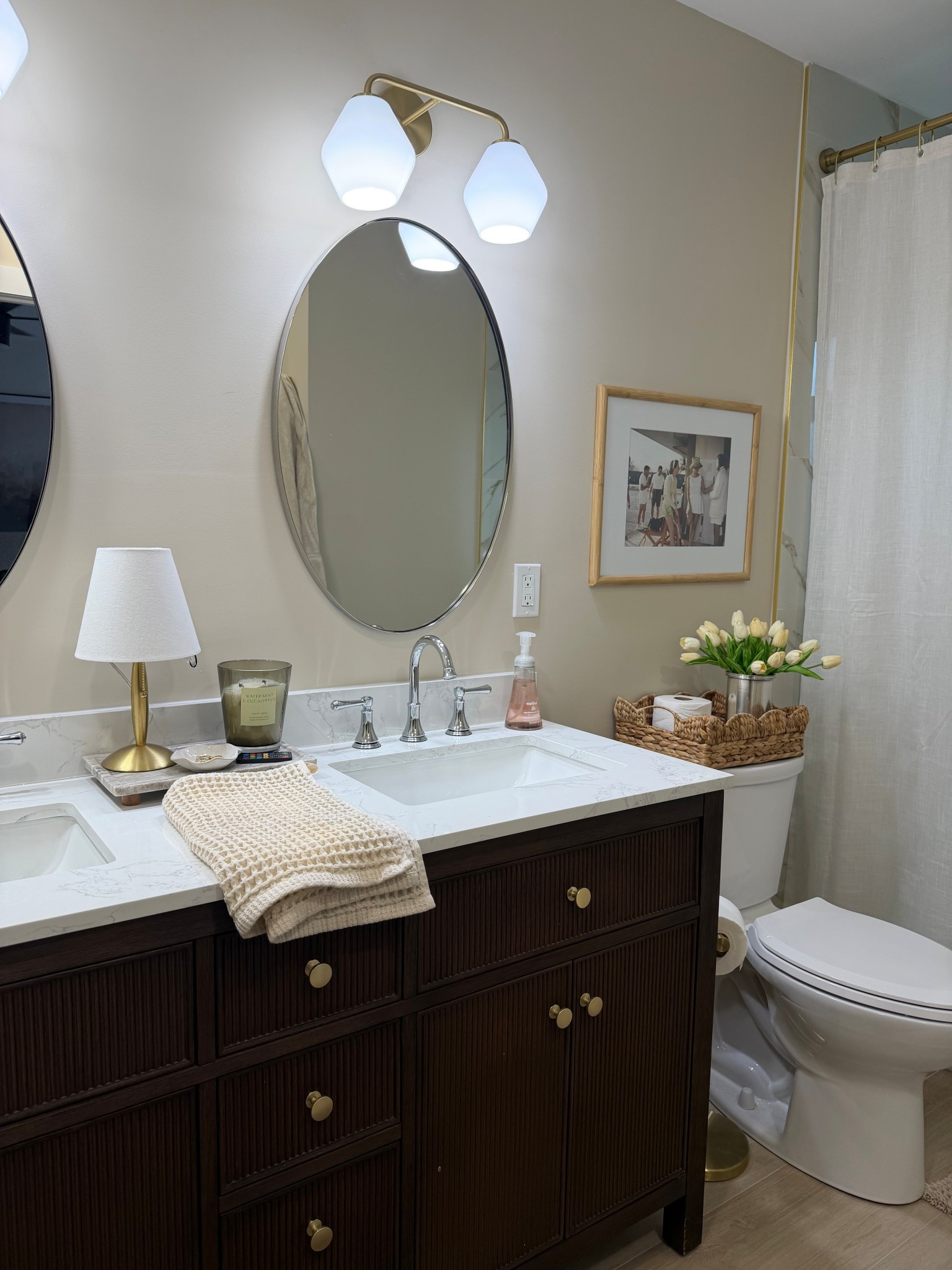 Neutral mixed metals primary bathroom, slim Aaron prints, walnut bathroom vanity, polished chrome fixtures, gold hardware 

#LTKHome #LTKSaleAlert