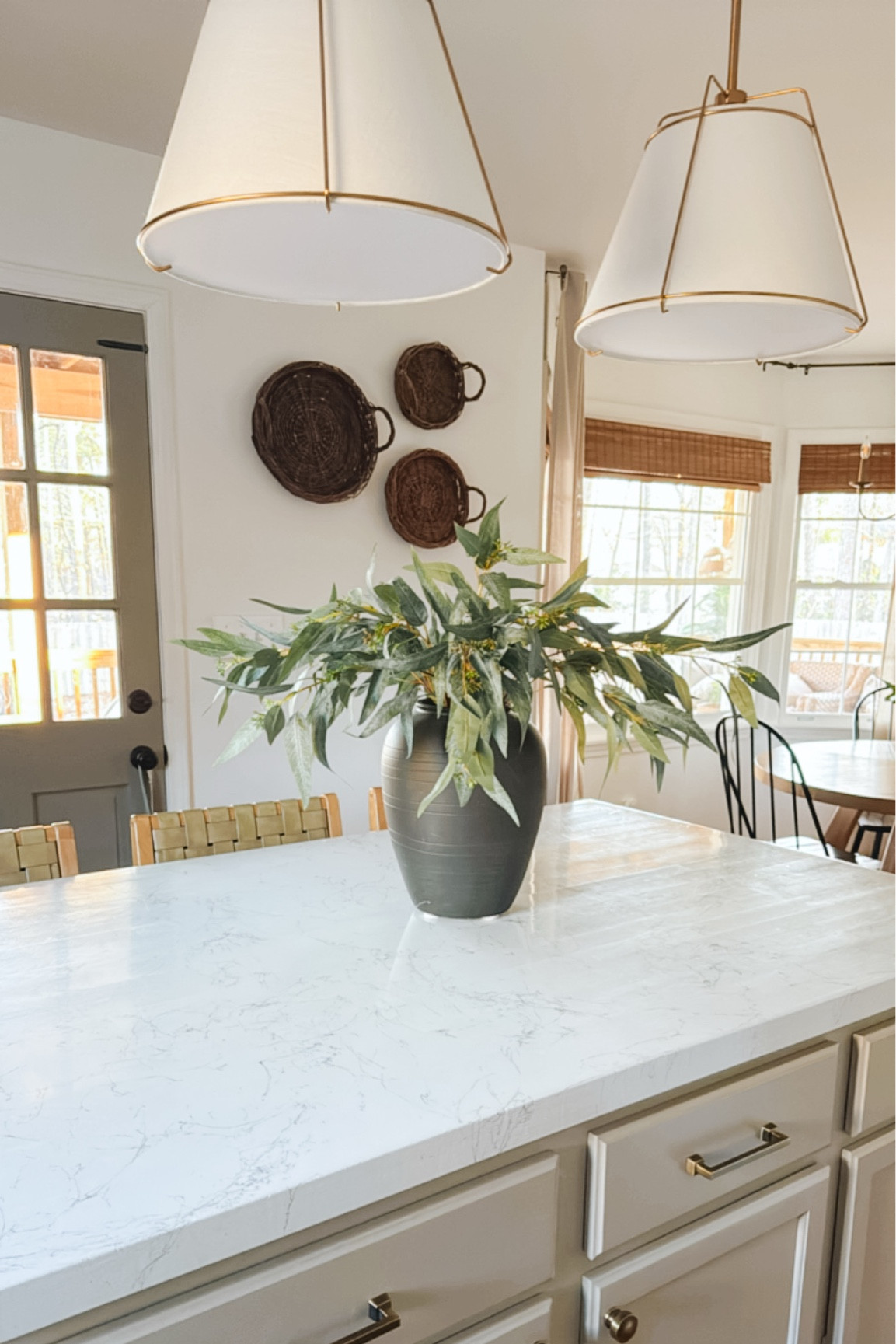 Kitchen morning view 

Pendant lights 
Wall decor 
Greenery stems 
Kitchen Island 
Kitchen lighting


•back door BM Taiga
•island BM Pashmina
•walls BM Chantilly Lace 

#LTKStyleTip #LTKHome #LTKSeasonal