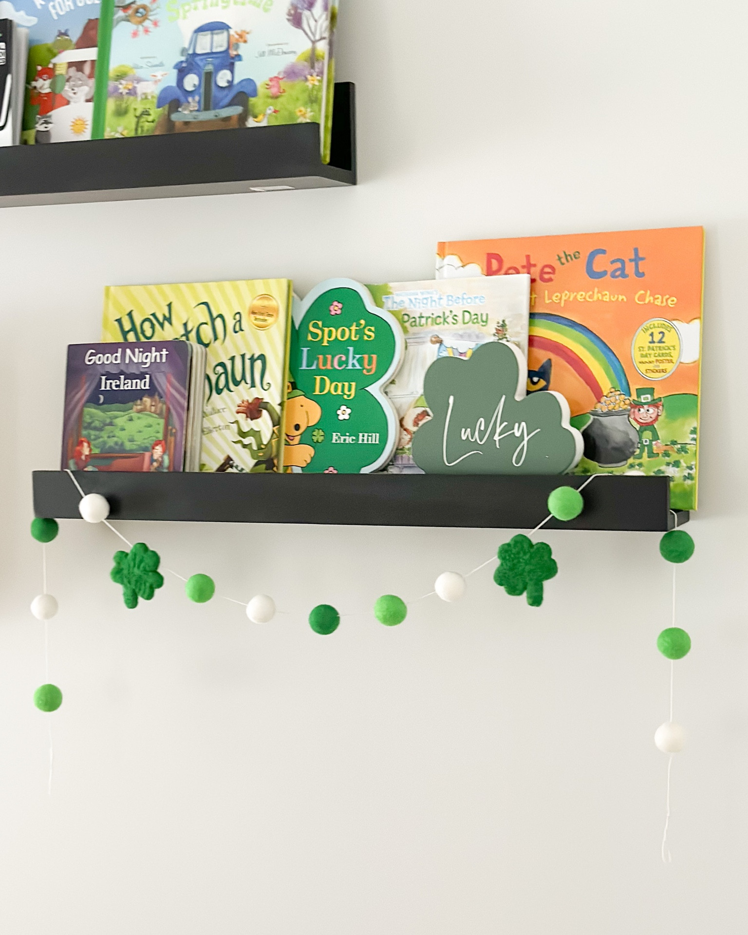 St Patrick’s day for kids 🍀 
• st paddy’s books, nursery decor, kids room, bookshelf decor, Irish, clover garland, holiday theme, Pete the cat, spots lucky day, goodnight Ireland, how to catch a leprechaun 

#LTKbaby #LTKhome #LTKSeasonal