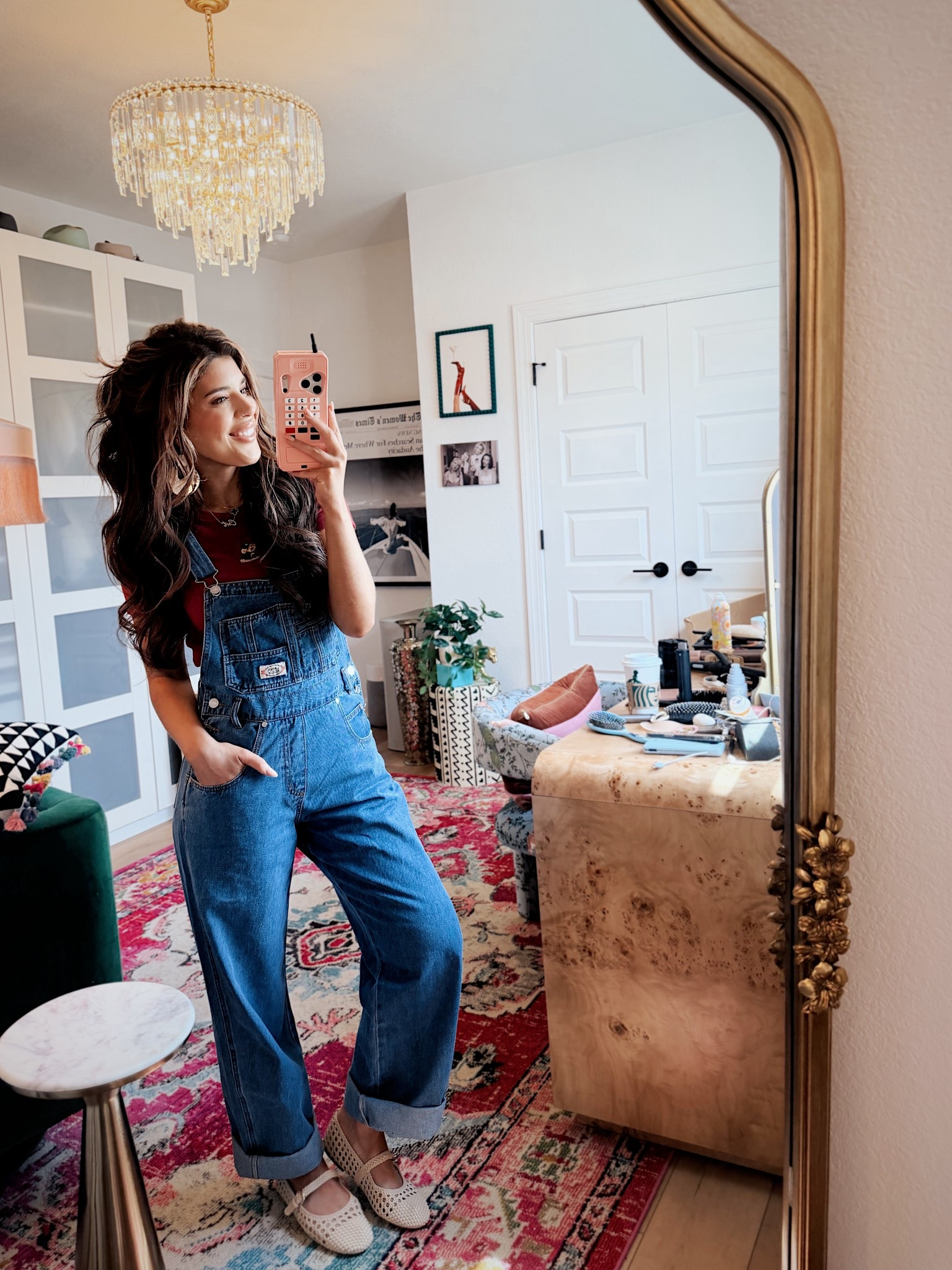 Wearing a size small in tee and overalls 