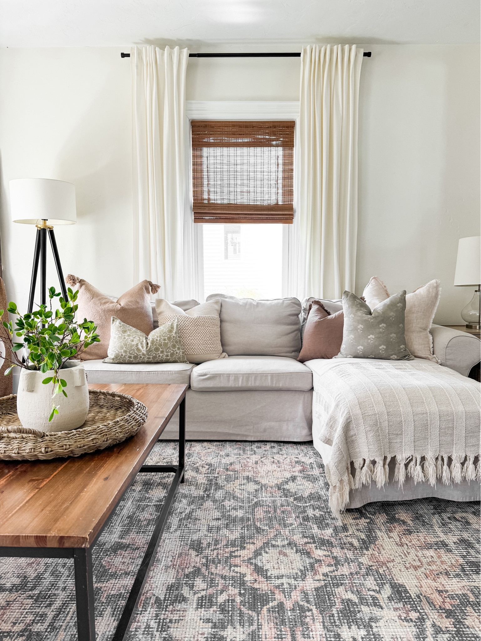 Neutral Spring/Summer Living Room. Spring throw pillow combinations. Spring stems, bamboo shades. 

#LTKhome 

#LTKSeasonal