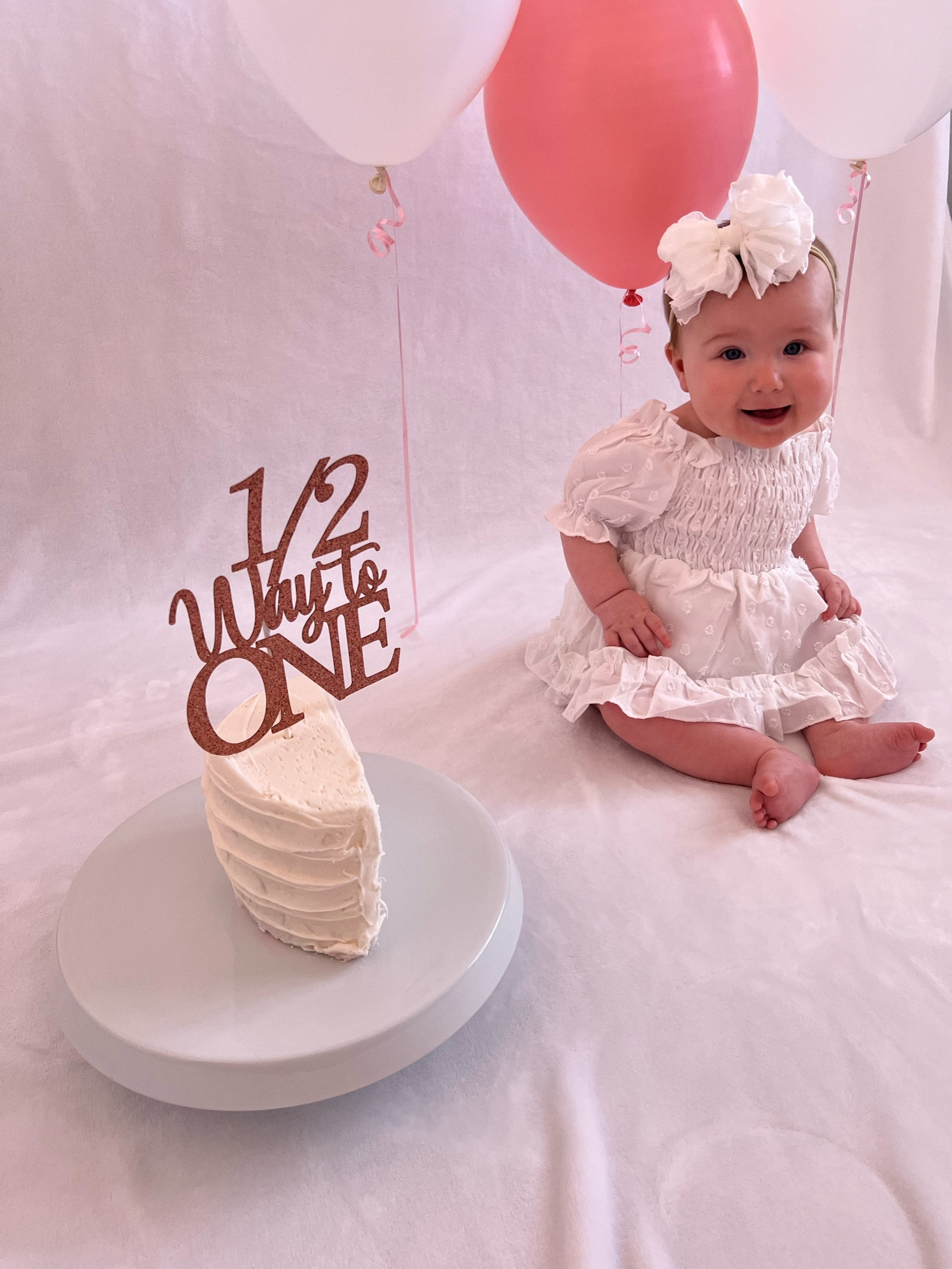 Half Birthday at home photo shoot idea for a baby girl. Put up a white blanket and some balloons. Used styrofoam to make a fake cake with the perfect topper. 

#LTKhome #LTKkids #LTKbaby