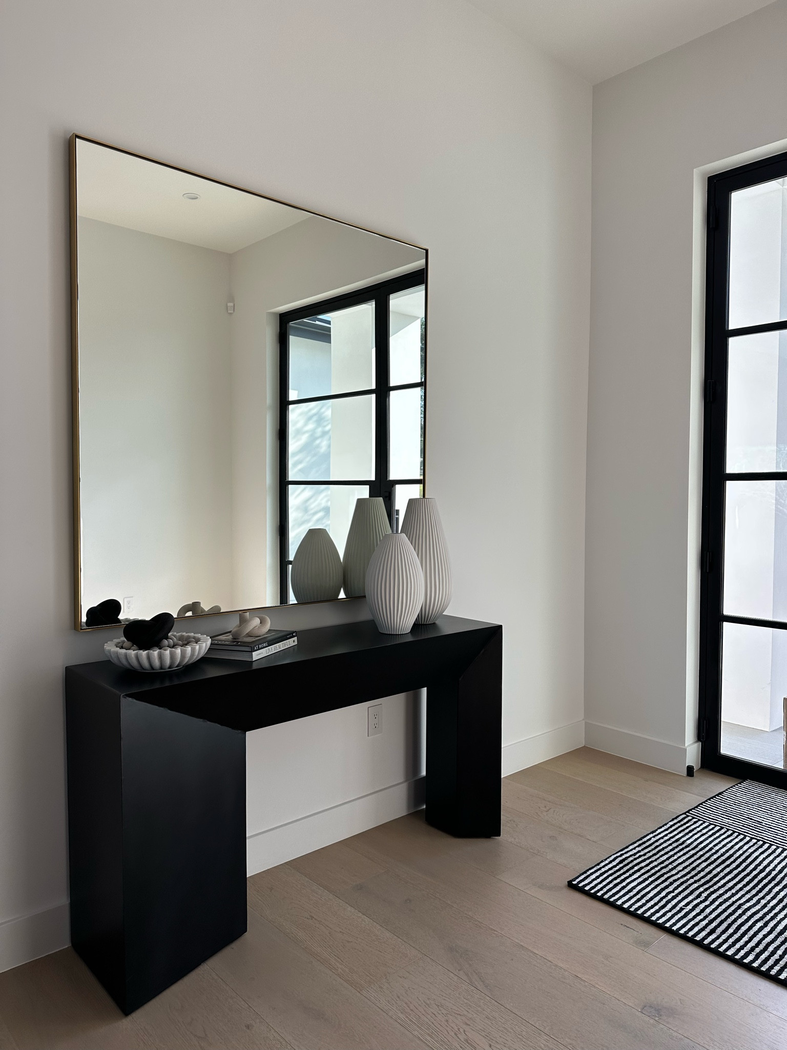 Entry way decor. This space is a work in progress but linking what we’ve got. The mirror is from restoration hardware and the table is arteriors 

#LTKhome