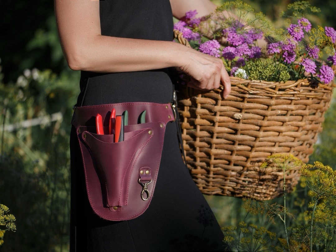 Crafted for both beauty and utility, this genuine leather tool belt by SKLKT is a dream accessory for florists, gardeners, and anyone who loves working with their hands. Made from waxed cowhide leather, it’s durable, lightweight, and only gets better with age. Available in rich colors like Cognac, Deep Green, and Marsala, and fully customizable with laser engraving—this belt is as personal as it is practical. A stylish, functional gift for the garden or floral pro in your life! #LeatherToolBelt #SKLKTDesigns #FloristEssentials #EtsyGardenGifts #GardeningInStyle #LTKGardenStyle #PersonalizedGift #FloristTools

#LTKFindsUnder100 #LTKHome #LTKSeasonal