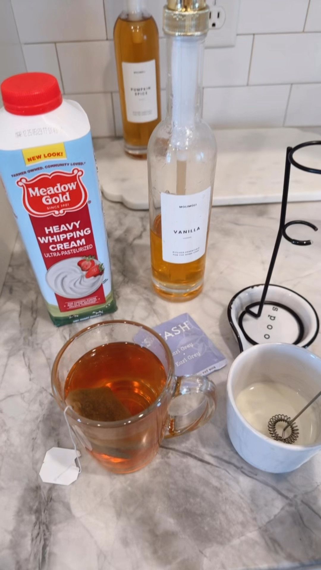 Chilly day… London Fog Tea time

Recipe:
Earl Grey tea bag
Vanilla syrup 
Heavy cream

Steep tea 
In another cup froth vanilla syrup and heavy cream (amount is to your liking)
I do 1/2 cup cream 3 pumps vanilla froth and split it between two tea cups (mine and my hubbys)  pour over tea and froth again or gently stir..
Yum

-My syrup dispensers come in 2 pack with several labels 
- Early Grey tea
-Clean glass cups
-Frothier 
-syrups I like to have at our coffee /drink bar
Vanilla, Carmel, pumpkin spice mocha/  peppermint 

-White marble tray


#LTKGiftGuide #LTKHome #LTKWatchNow