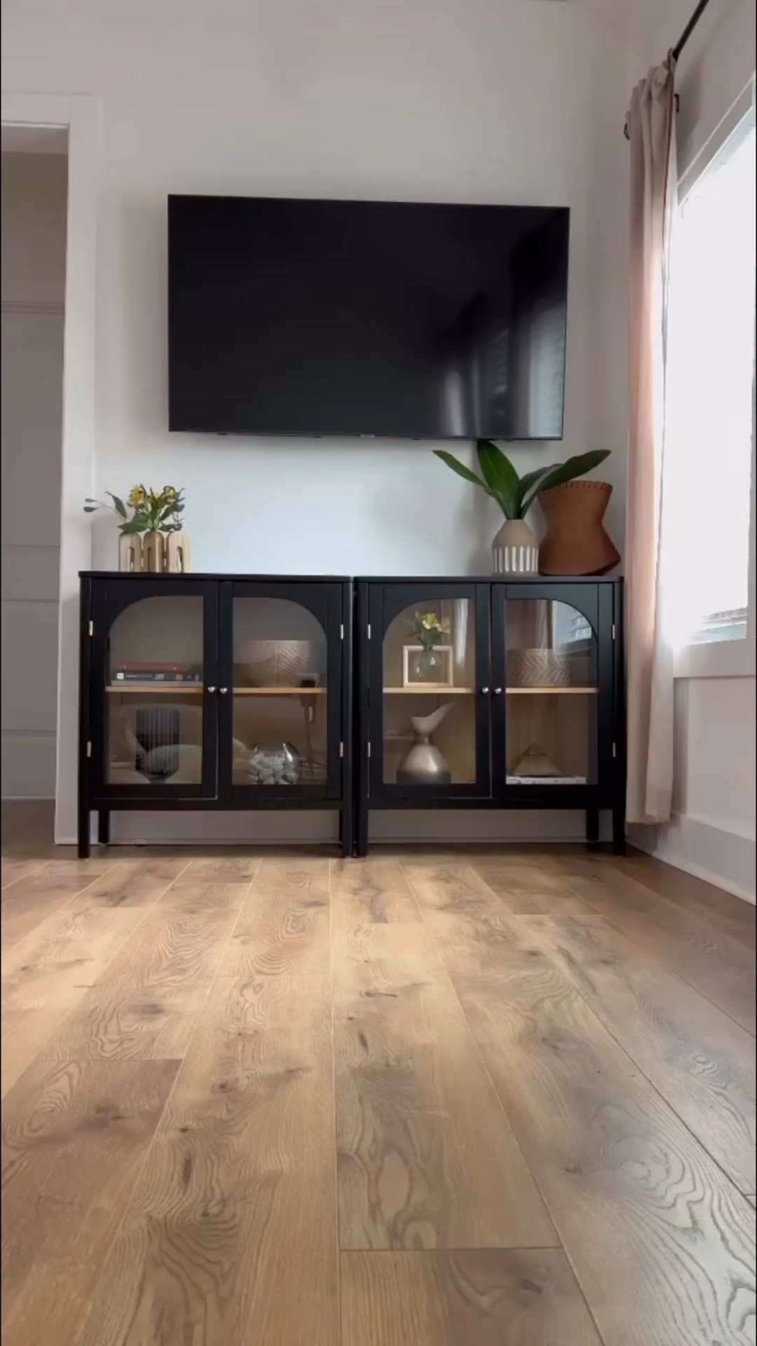 A true garden staple! 🌱 I’ve had my eye on a Corten Steel planter for a while, and then I came across @diycartel and fell in love 😍. Definitely plan on getting more in the future! 

Also the cabinets behind me are the perfect mix of style and storage—sleek glass doors, warm oak wood, and plenty of space for all my plant babies and home essentials. 

#LTKSaleAlert #LTKHome