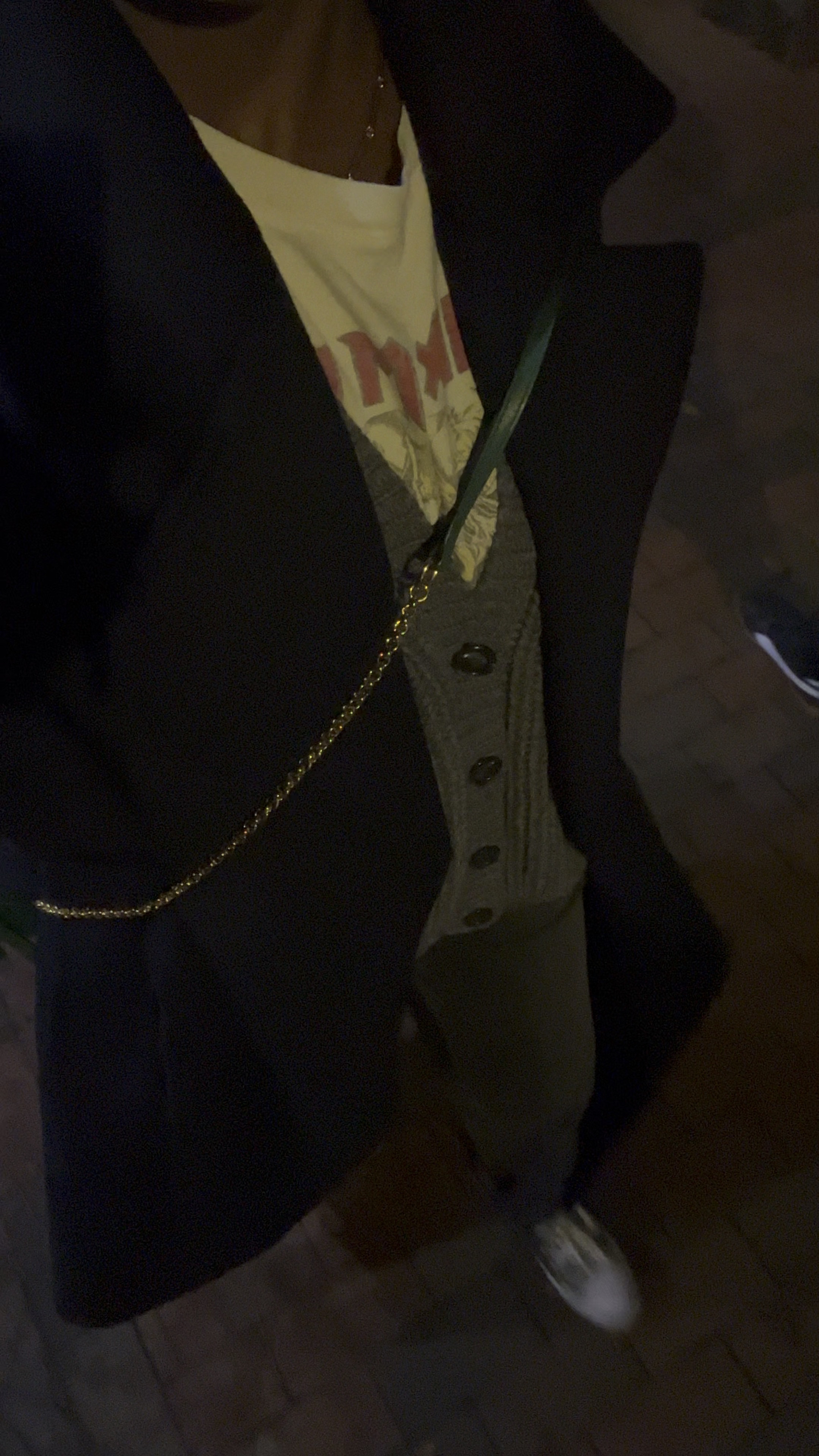 Black jeans and a white graphic tee styled with my favorite winter coat and black high top converse, a grey cardigan and green mini bag 

#LTKstyletip #LTKSeasonal #LTKVideo