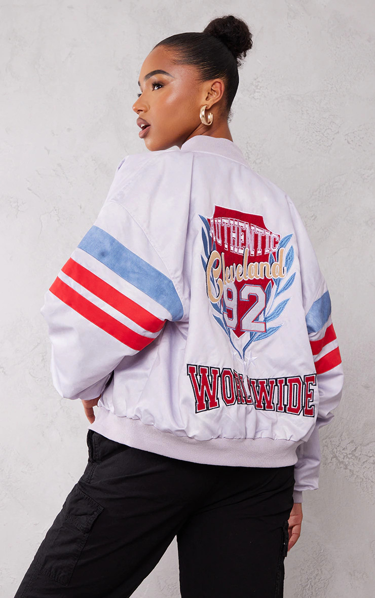 PRETTYLITTLETHING Blue Graphic Front Satin Look Varsity Bomber Jacket | PrettyLittleThing US