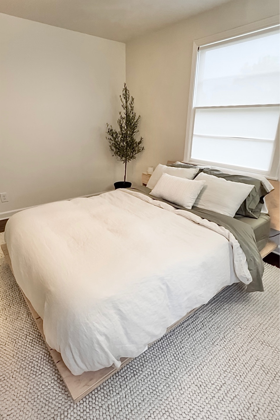 the bedroom is coming together 🤍 
modern bedroom, white duvet, duvet cover, green sheets, linen bedding, olive tree, cream rug, wool rug, braided area rug, mid century modern, mcm, japandi style, neutral home, neutral decor, platform bed, floyd bed, nightstand

#LTKhome #LTKFind #LTKstyletip