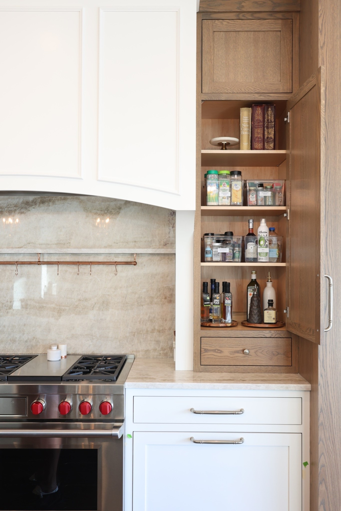 Keep only what you use daily within arm’s reach of your stove. Oils, salt, pepper, and your most-used utensils deserve prime real estate. Everything else—extra spices, specialty oils, and bulky gadgets—can live in nearby cabinets to keep your cooking zone functional, clean, and clutter-free. 🤍