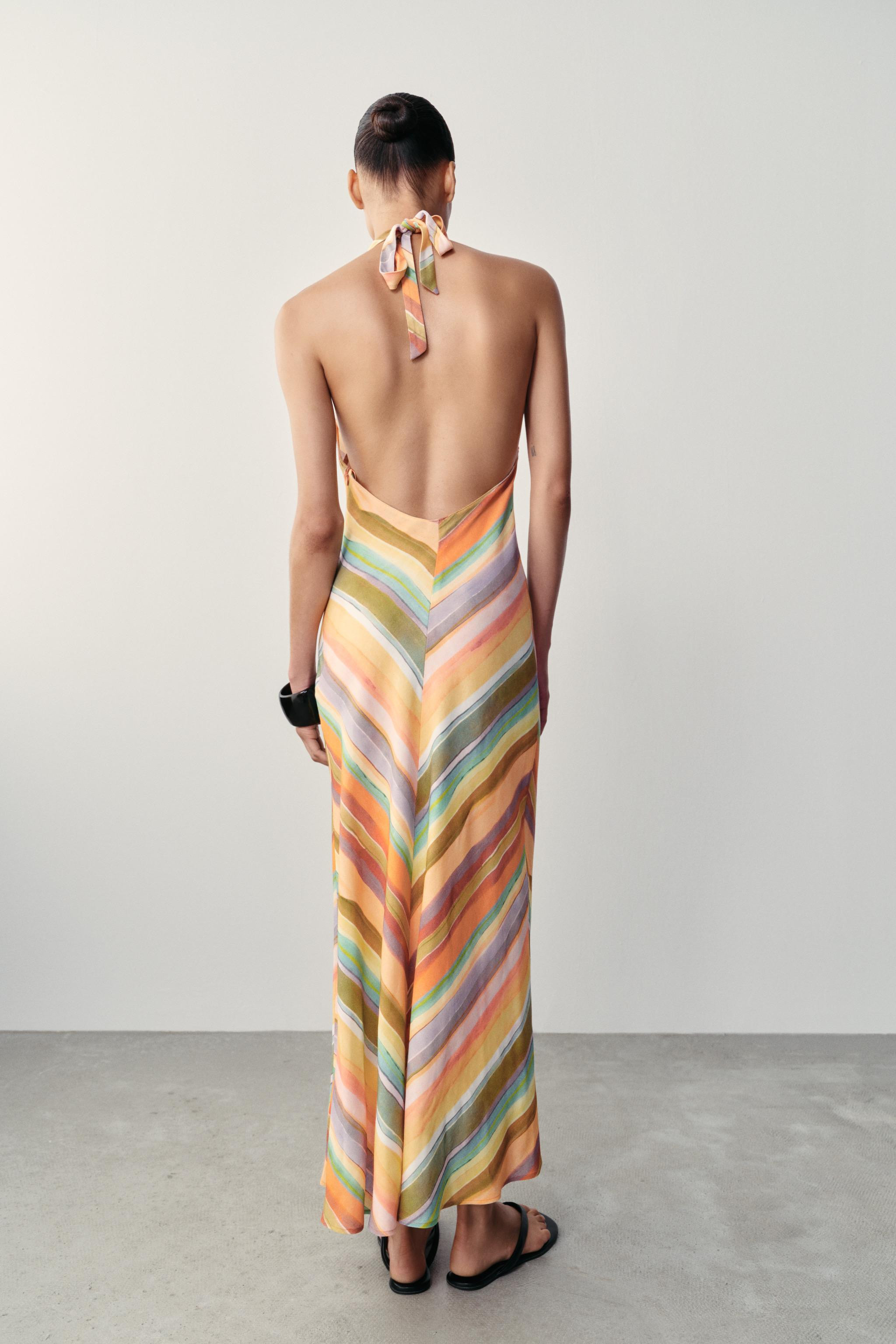 Model height: 179 cmHalter neck dress with a V-neck and an open back. Featuring a concealed side ... | Zara UK