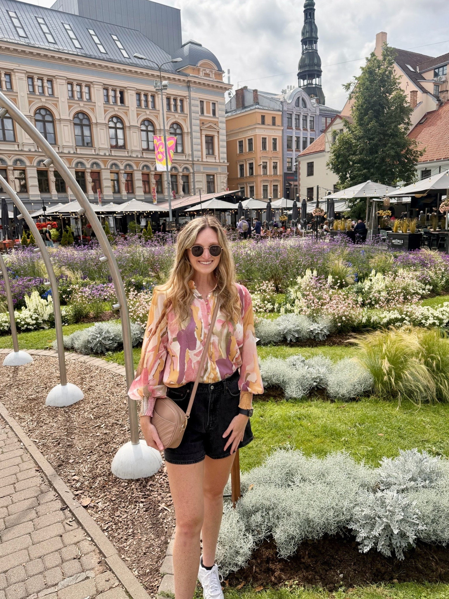 Comfortable, affordable fall transition outfit. Lightweight long sleeve floral flowy top with black jean shorts and crossbody beige purse

#LTKTravel #LTKTall