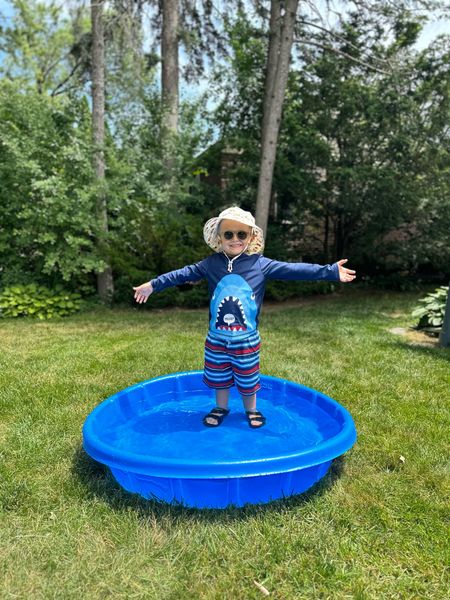 Toddler/child kiddie pool, with shark rash guard and striped toddler swim trunks.  

Also LOVE this construction bucket hat and toddler sunglasses! 

#LTKSummerSales #LTKFamily #LTKKids