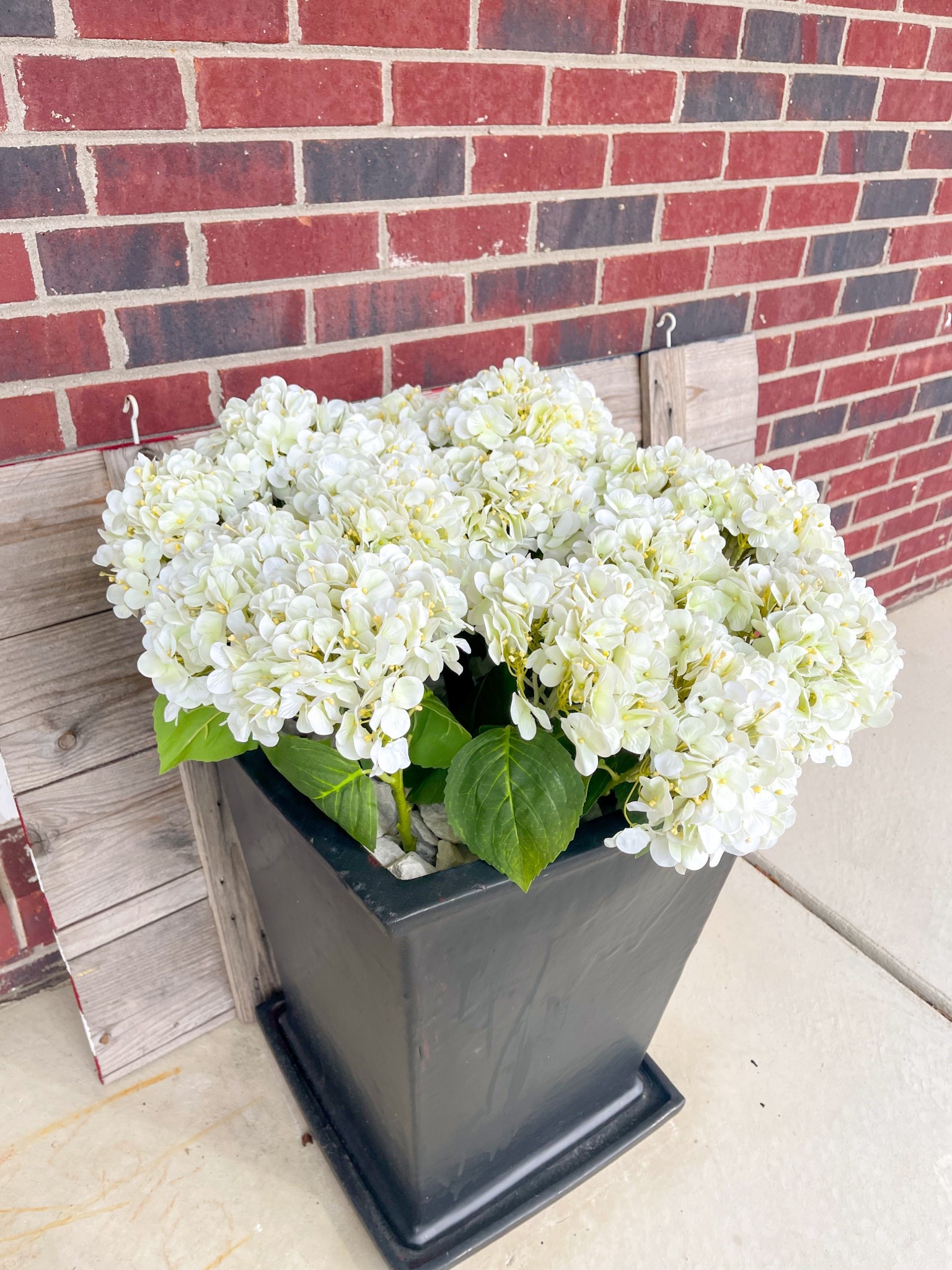 Faux white hydrangeas for our front porch decor this season! Perfect for spring and summer, and on sale from Walmart right now 😍🫶

Walmart home, spring decor, porch decor, porch planters, faux plants, faux flowers, Walmart decor 

#LTKSeasonal #LTKHome #LTKFindsUnder50