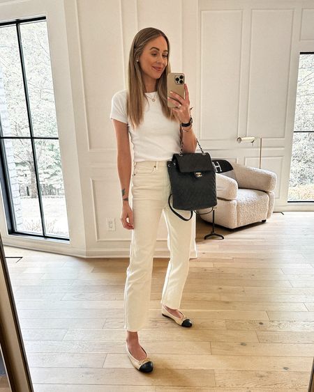 Fashion Jackson wearing white tee (small), ecru jeans (run small go up 1-2 sizes in wearing a 28 and normally wear 26 in AGOLDE), Chanel ballet flats, Chanel backpack #fashionjackson #summeroutfit #whitejeans #chanel #balletflats  

#LTKstyletip #LTKFind #LTKunder100