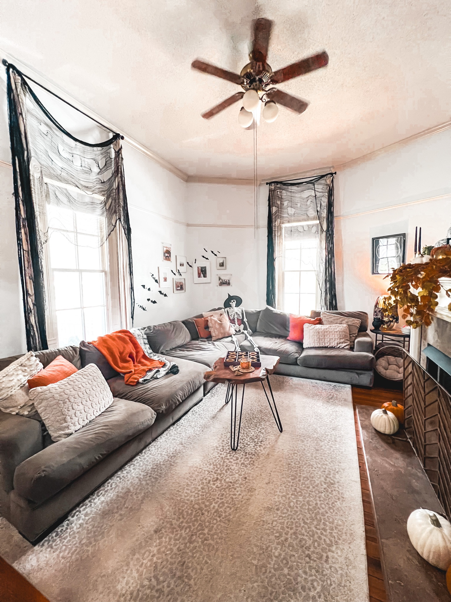 Halloween decor living room couch animal print rug fall decor 