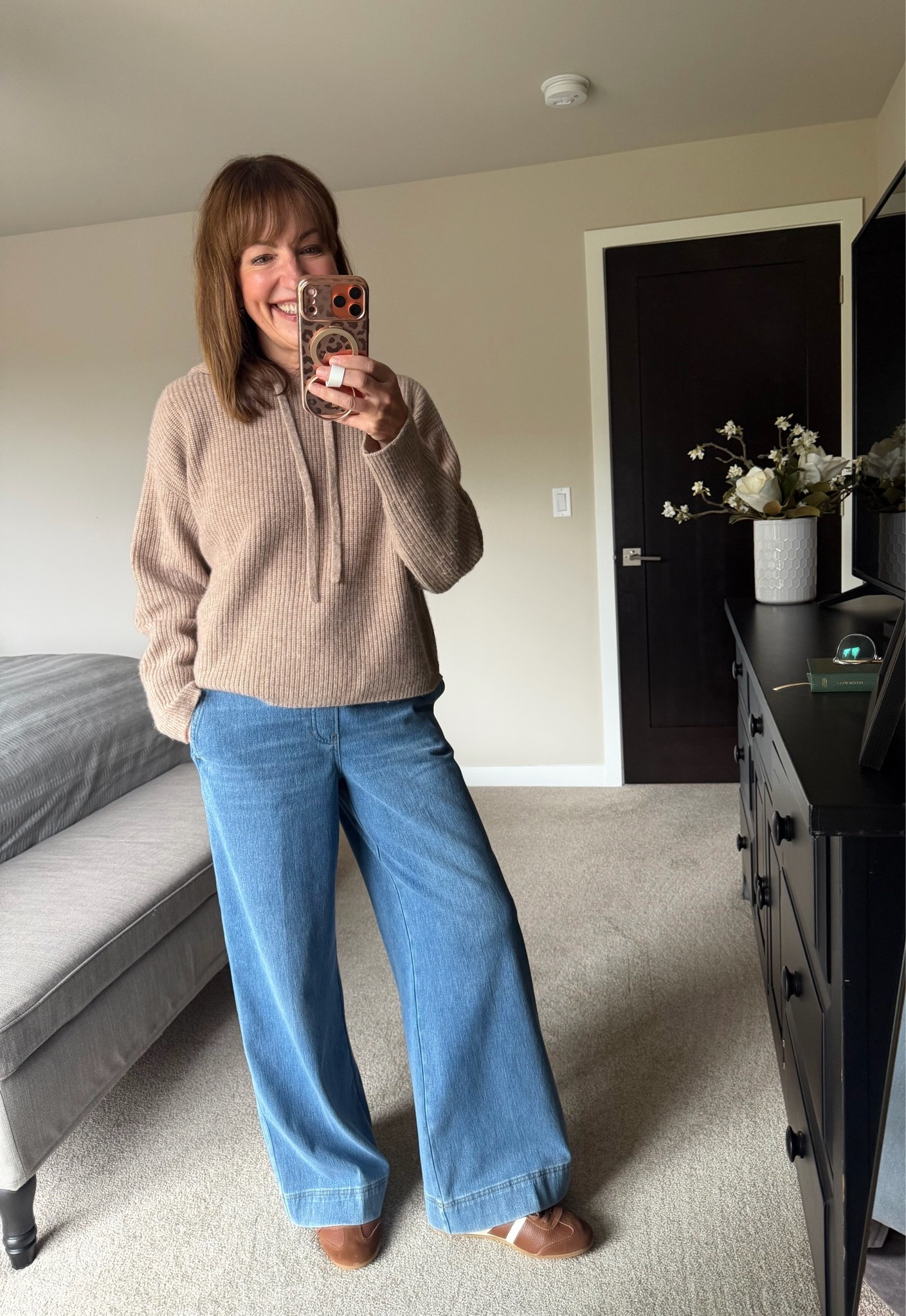 Outfit of the day for errands! I’m loving my @Spanx Denim-ish pants! They’re the Spanx version of a kind of softer jean that is popping up everywhere! Love the pull on style and pockets! Paired with my super soft hoodie sweater and comfy @Quince sneakers. Casual and cute for the grocery store!

Wide leg denim, leather sneakers, hooded sweater