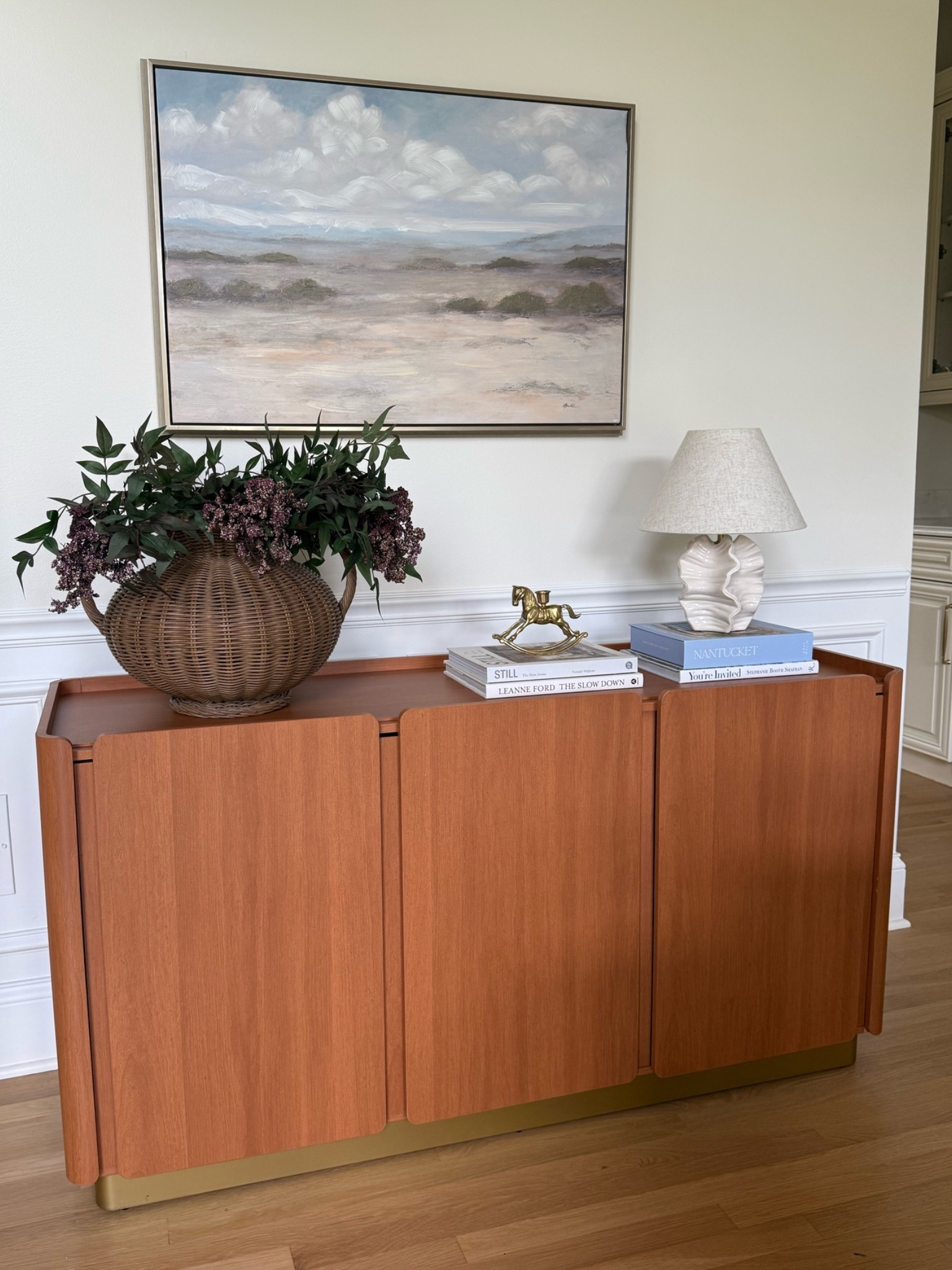 Walmart Home Sideboard Styling! Can you believe this TV stand that I am using here as a console/sideboard is on sale now for under $190 🤯 it’s so beautiful and comes with plenty of storage underneath too! Here I put a woven vase, stems, books, a lamp, and decorative object on top! What do you think of it?

#LTKHome