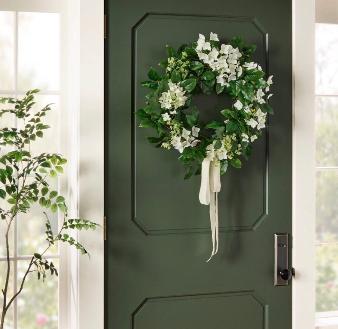 Lend natural charm to your interiors by hanging this Artificial Hydrangea Wreath from Threshold™ designed with Studio McGee. This circular wreath is covered with lush green leaves and white hydrangea flowers and features a white ribbon in the center for an elegant finishing touch. Suitable for indoor use only, it also has a back loop for easy hanging

#LTKSeasonal #LTKValentine #LTKHome