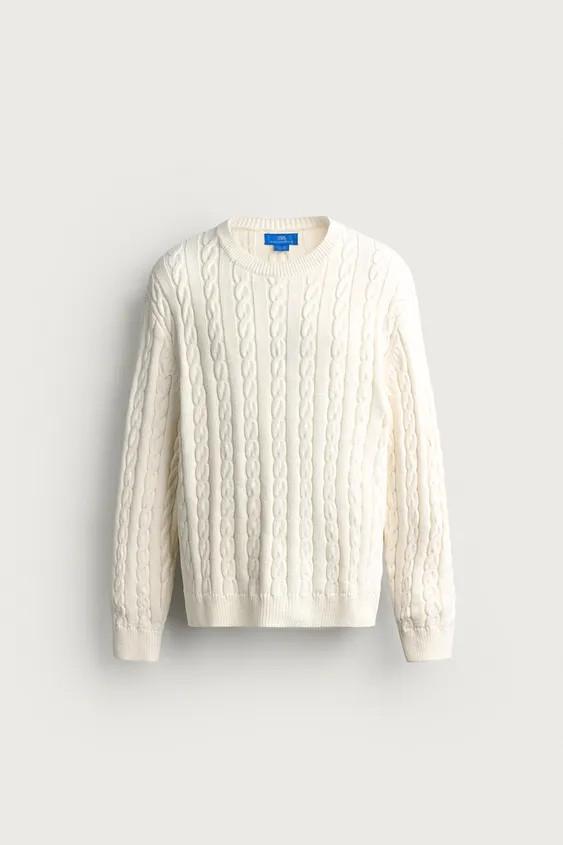 Model height: 188 cmRegular fit knitted jumper made from a cotton blend yarn. Featuring a round n... | Zara UK