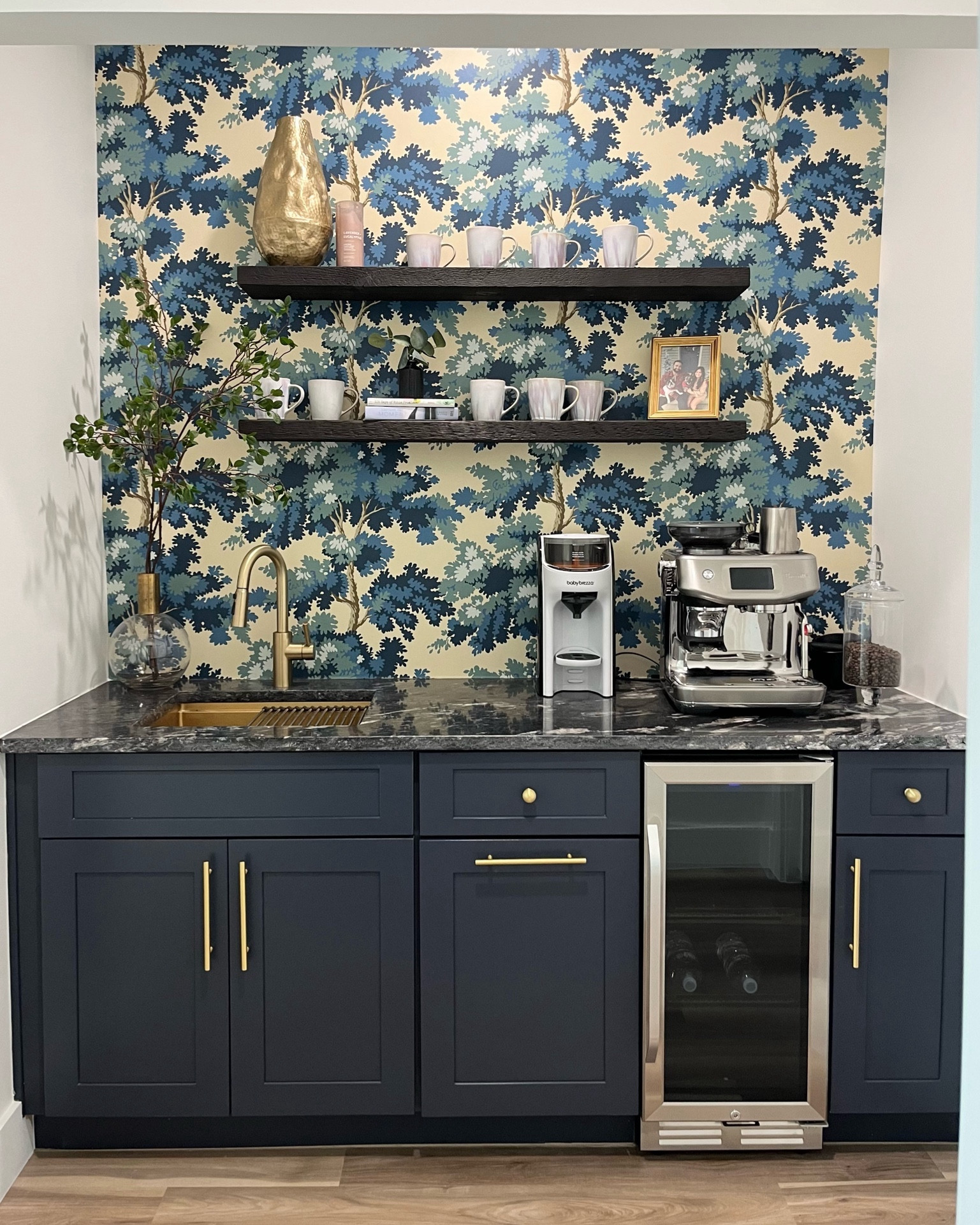 Our coffee nook! I love this little space in our house 🤍

Sandberg wallpaper. Coffee room. Coffee nook. Espresso machine. Clear bulb vase. Navy cabinets. Gold hardware. Amazon home finds. Breville. Interior design. 

#LTKhome
