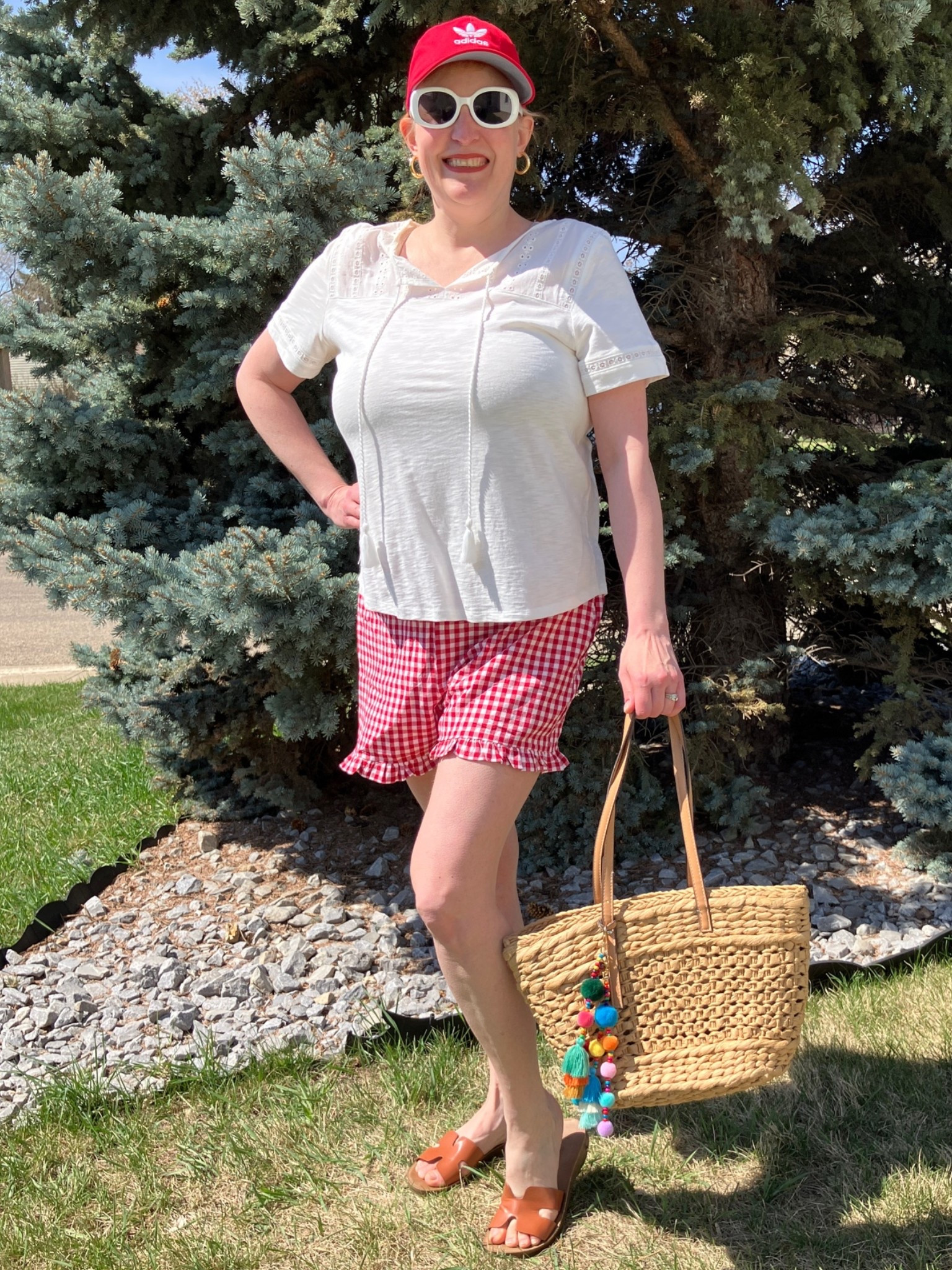 Don’t wait for a star to fall and miss out on these cute gingham ruffled shorts! They are a great price right now and come in many colours. So comfy and cute! For my first styling of them, I was conservative and just paired them with a white t, red cap, and neutral bag, sunnies, and sandals. I feel so ready for summer even though the last few days have been cool and windy. Canadians click on the first links to shop, and Americans click on the second links to shop. If there’s only one link then you can shop it in your own country. And remember, trendy doesn’t have to be expensive! Bye!

#LTKsummer #LTKcanada #LTKover50style
