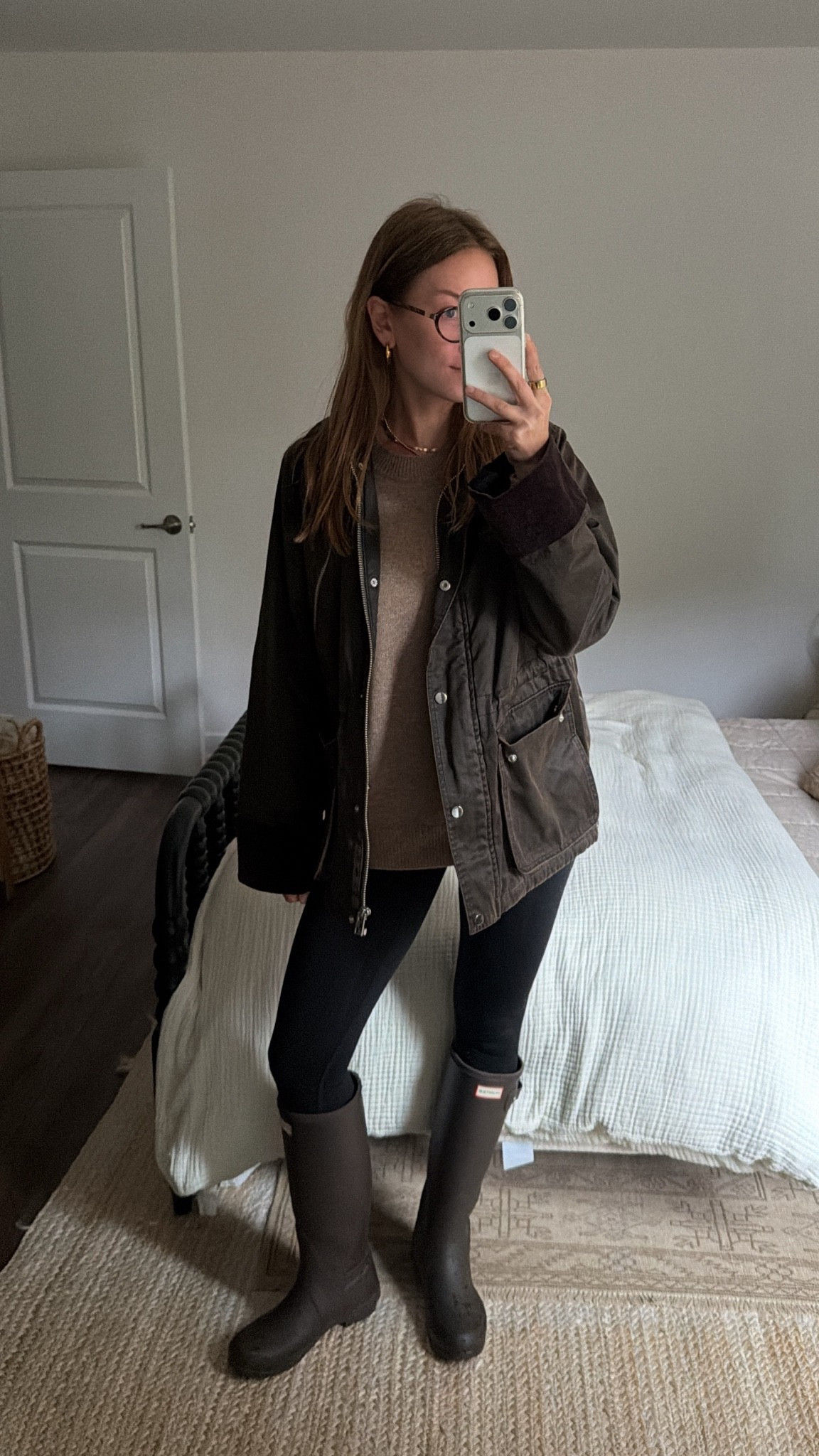 10/12/26 Cozy Rainy Day Fall Outfit ☔️🍂

Sunday's cozy rainy day outfit ☔️🤎 Keeping it casual + comfy in my @Hunter rain boots, black leggings from an old workout set, @Aritzia sweater + an older @mintvelvet jacket.
Finished the look with my oval blue light glasses from Amazon! Linking everything I can!