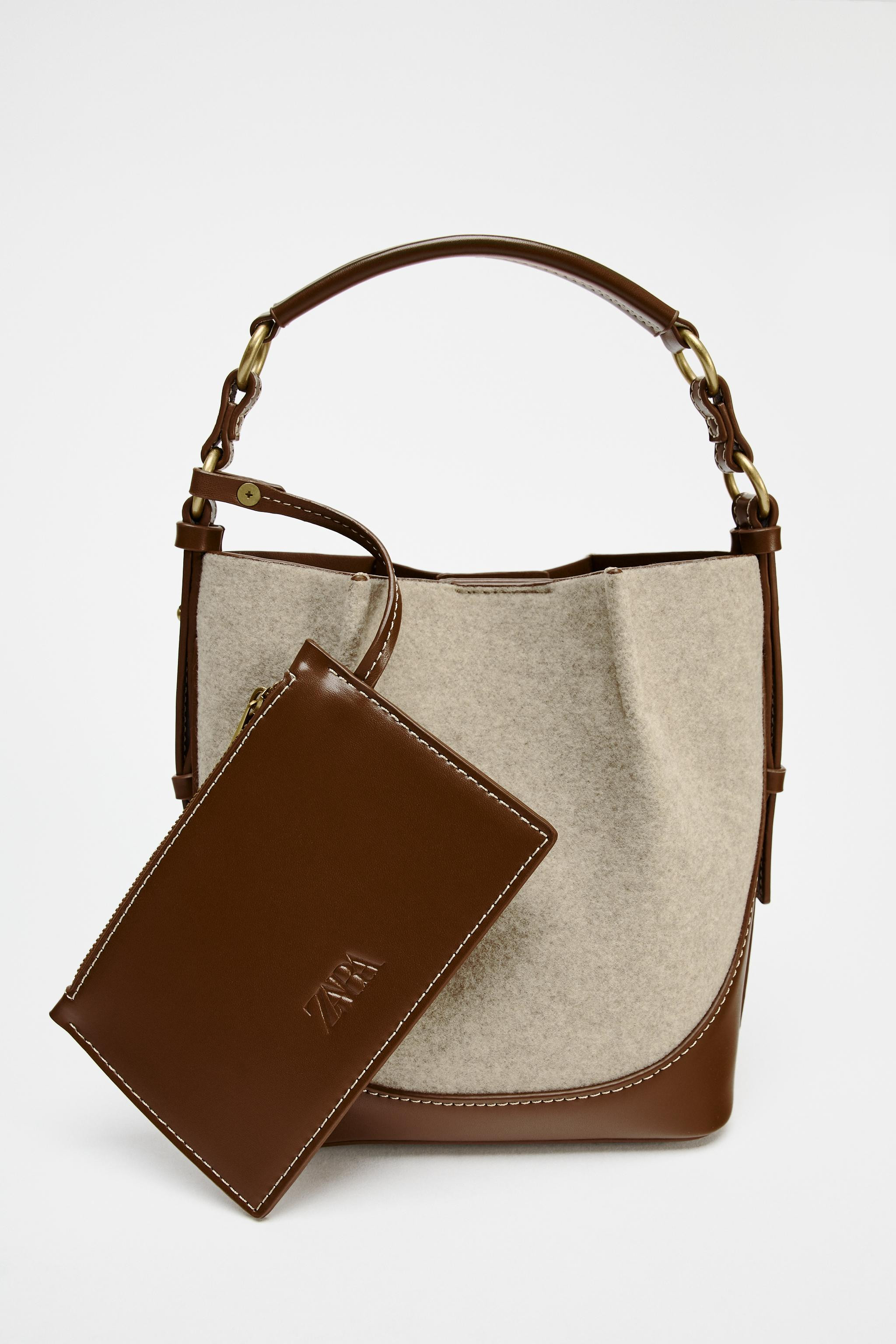 Bucket bag in woven fabric with contrast topstitching. Top handle and double adjustable and remov... | Zara UK