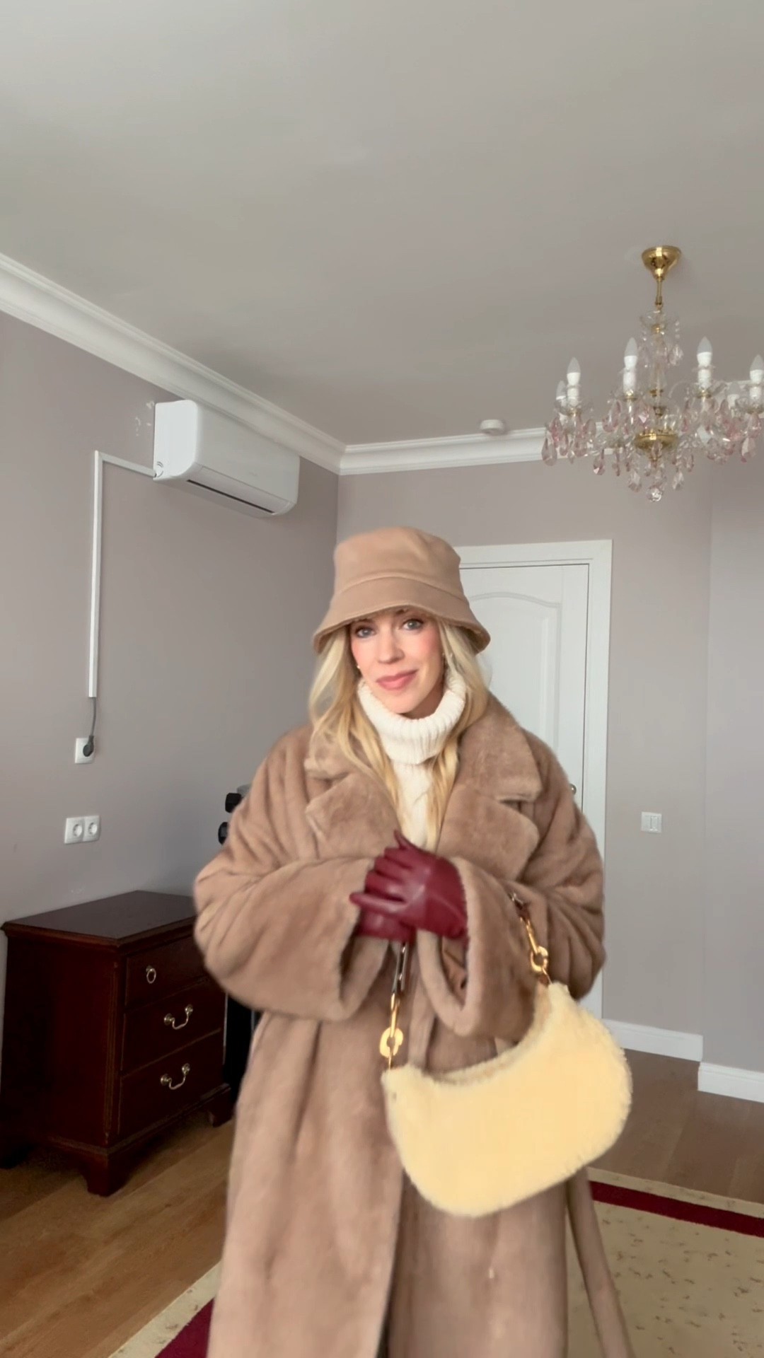Camel fur coat, Christmas market outfit, shearling bucket hat, cream cable knit sweater, red leather gloves, Zara mom jeans, shearling handbag, cozy winter shopping look

#LTKFindsUnder50 #LTKHoliday #LTKootd