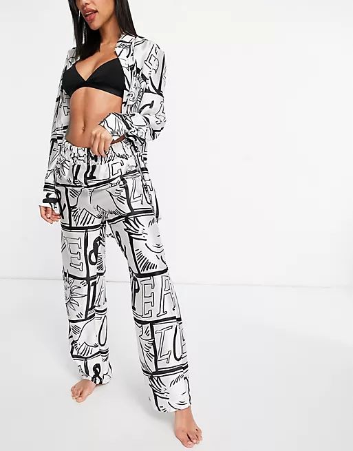 ASOS DESIGN premium love & peace satin oversized shirt & ruched waist pants pajama set in black &... | ASOS (Global)