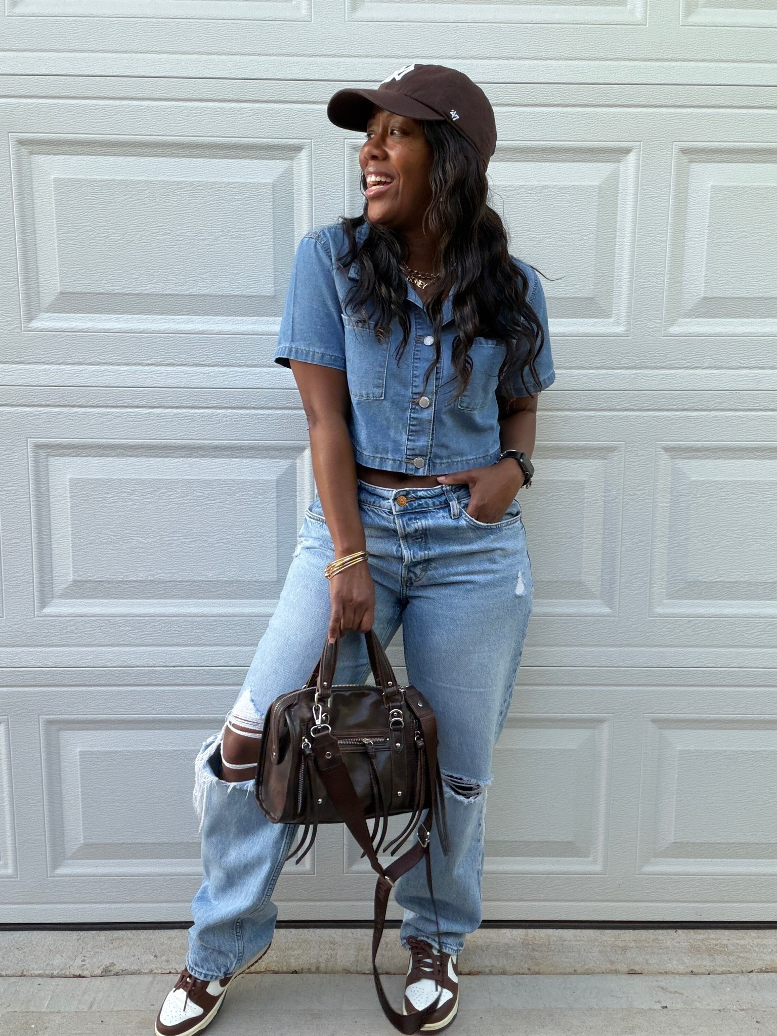 Denim on denim outfit. I’m wearing a cropped denim shirt, high waisted &denim distressed jeans, brown hat, brown faux leather purse, and brown and white Nike dunk low cacao wow sneakers.

#LTKootd #LTKPetite #LTKOver40