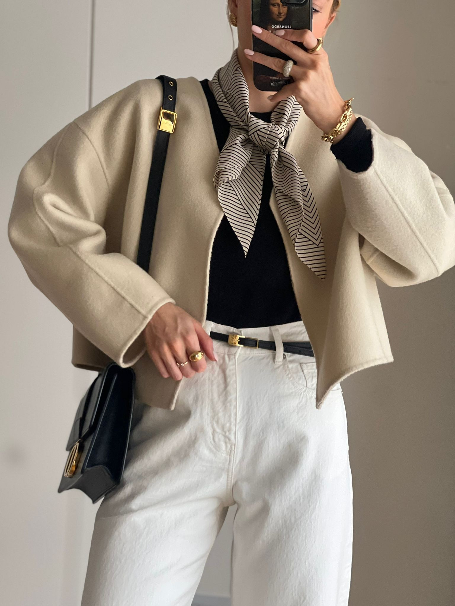 Toteme scarf, silk scarf, loewe belt, thin black belt, white jeans, northskull bracelets, gold bracelets, dior bag, black satchel bag, gold rings 

#LTKSeasonal #LTKstyletip #LTKeurope