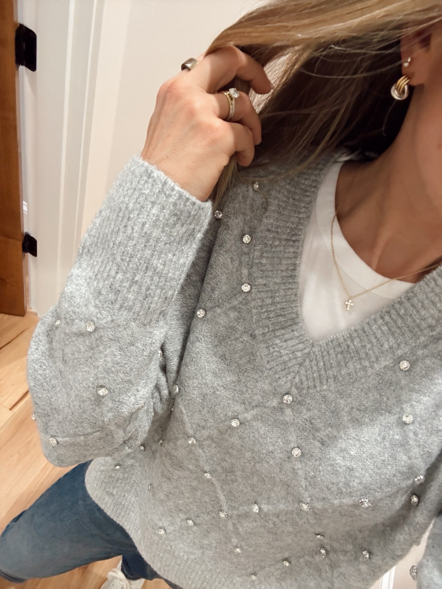 I love this rhinestone sweater and I’m loving two tone jewelry. The white tee is the best for layering under sweaters and it’s so cheap from Amazon!! I’ve bought the exact same ones for 6 years. It comes in a two pack - I just replace them every year so they always stay bright white. 

#LTKFindsUnder50 #LTKOver40 #LTKPetite