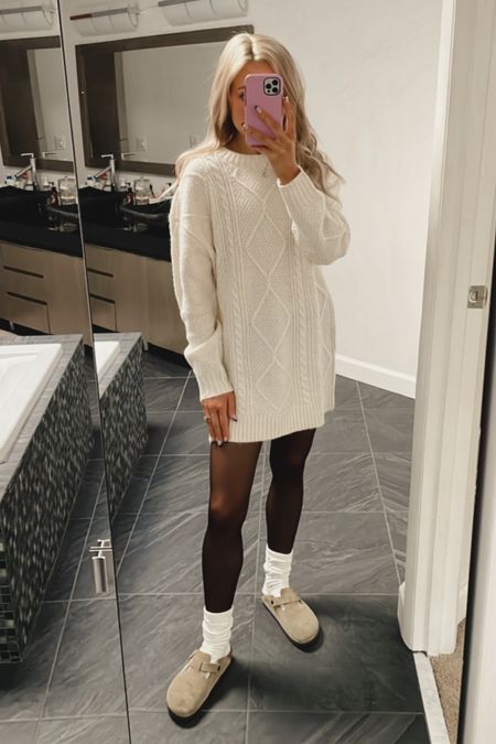 A laid back way to wear your cable knit sweater dresses this fall & winter.  Fall fashion is definitely my favorite!

• Cream Cable Knit Sweater Dress: American Eagle (XS - runs oversized. Stick TTS or size down 1 size for a smaller fit)
• Black Sheer Tights: Amazon
• Cream Scrunch Socks: UGG
• Taupe Birkenstock Boston’s

#LTKSeasonal #LTKHoliday #LTKGiftGuide