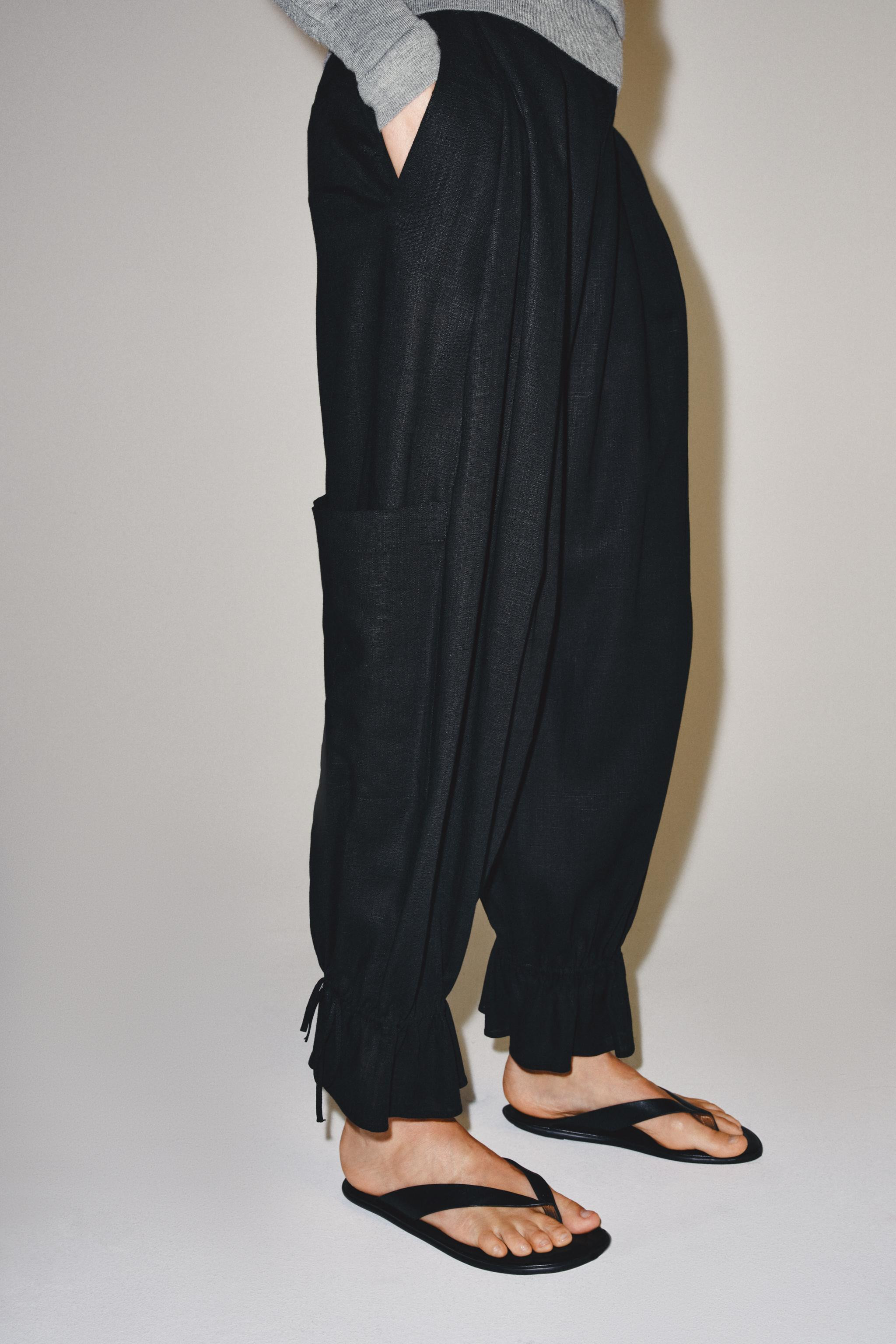 ZARA WOMAN COLLECTION. Mid-rise trousers made with 25% linen yarn. Features hidden side pockets a... | Zara US