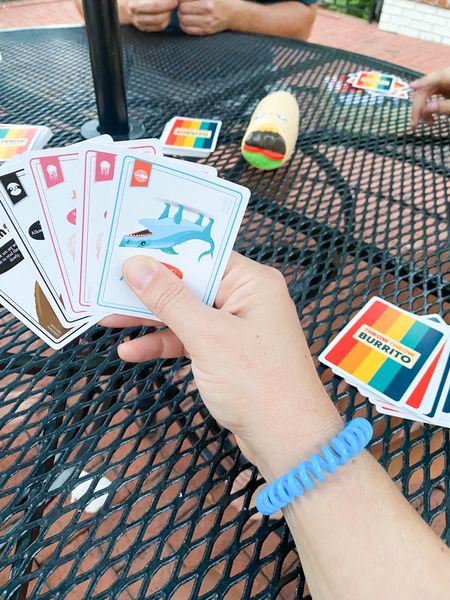 Throw, Throw Burrito is a fun family game… kinda like spoons, pass cards around until you make matches. Find certain cards and grab the burritos. Depending on the cards you have, you will throw, have a war, or dual with the burritos. It’s fun! We play outside so we don’t break anything!

#LTKfamily #LTKparties #LTKhome