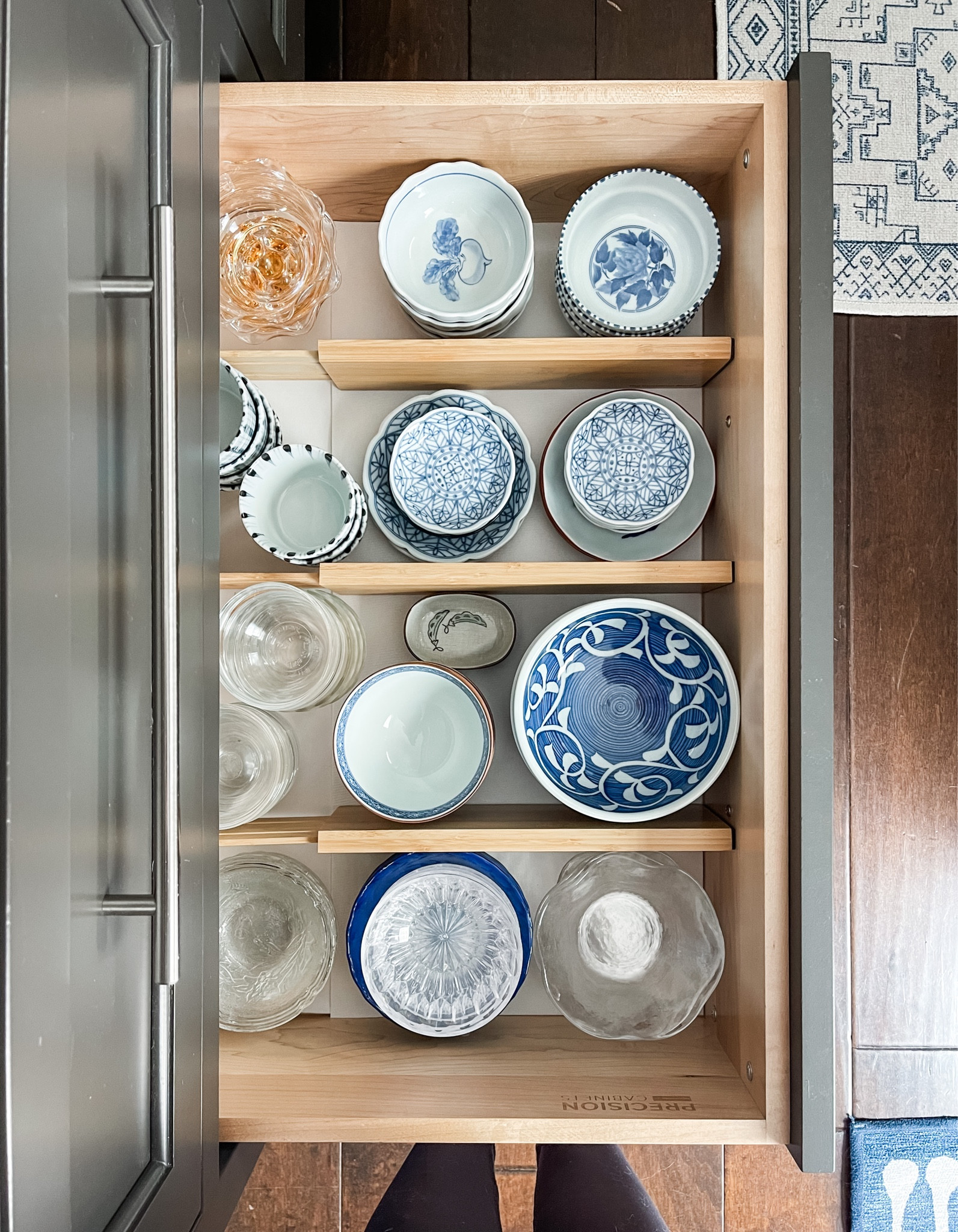 This drawer of fragile, special dishes were previously piled together causing them to bump into each other. I added a thin, soft, non-adhesive drawer liner to keep them from shifting … and added drawer dividers to keep them from toppling over, further bumping and to give a little order / boundaries.

#LTKfamily #LTKhome