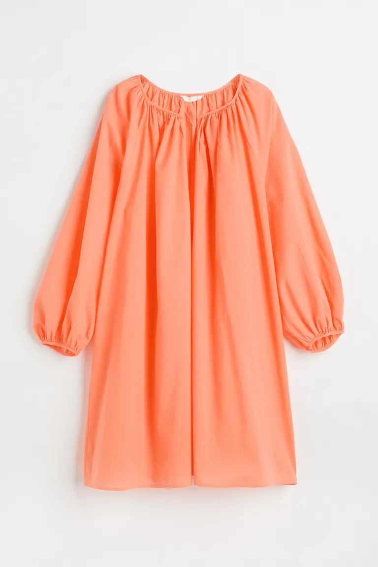 Short, oversized A-line dress in airy, woven cotton fabric. Round neckline with V-shaped opening ... | H&M (US + CA)