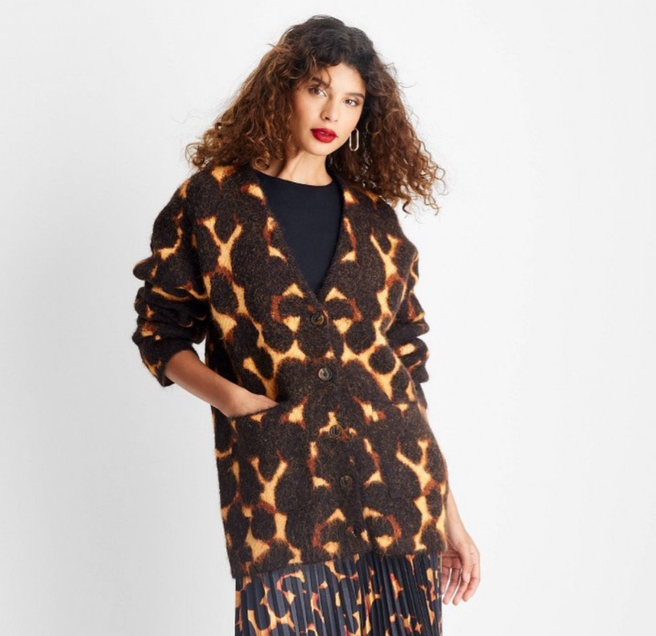 Future Collective Black Tortoise Oversized Cardigan is officially online! 

Relaxed cardigan in black with tortoiseshell print
•	Made from jacquard-knit recycled polyester blend with spandex
•	V-neck
•	Front button-down style
•	Ribbed cuffs
•	Tunic length
•	Front pockets

#LTKPlusSize #LTKFindsUnder50 #LTKMidsize