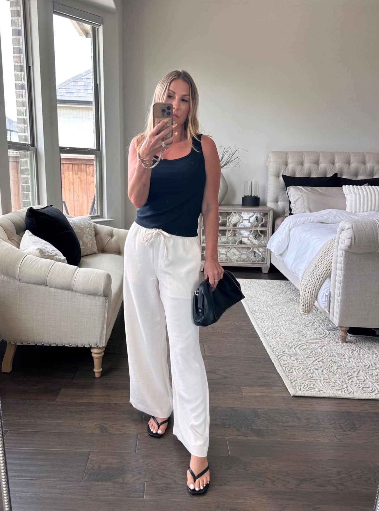 Easy black and white always feels polished. These wide-leg pants and simple tank are the kind of pieces I reach for when I want to feel put together without overthinking it. Finished with minimal jewelry, black sandals, and a classic bag. 🖤🤍

Tank: Aritzia • Pants: Aritzia • Sandals: Amazon • Bag: Amazon

#LTKStyle #LTKOver40 #SummerStyle

#LTKgrwm #LTKootd #LTKSeasonal