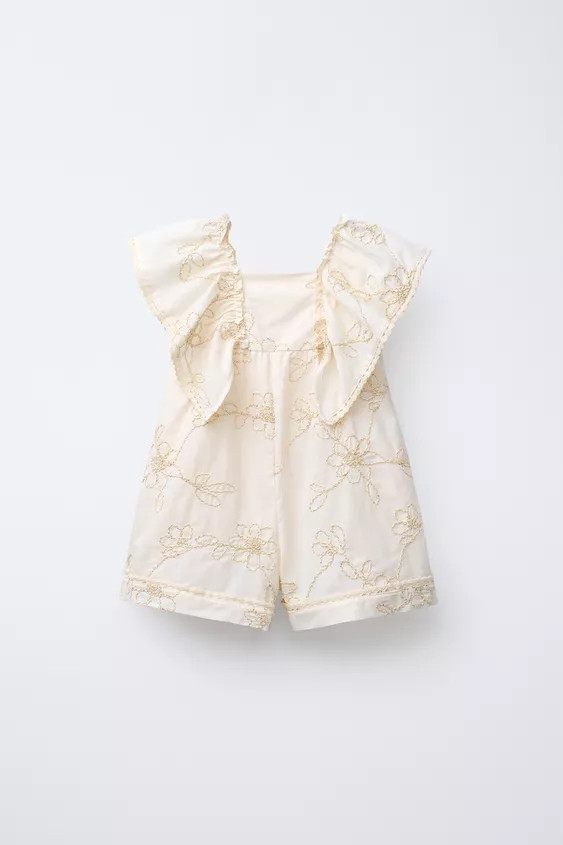 Short jumpsuit with straight neckline and short sleeves with lace trim. Embroidered floral detail... | Zara US