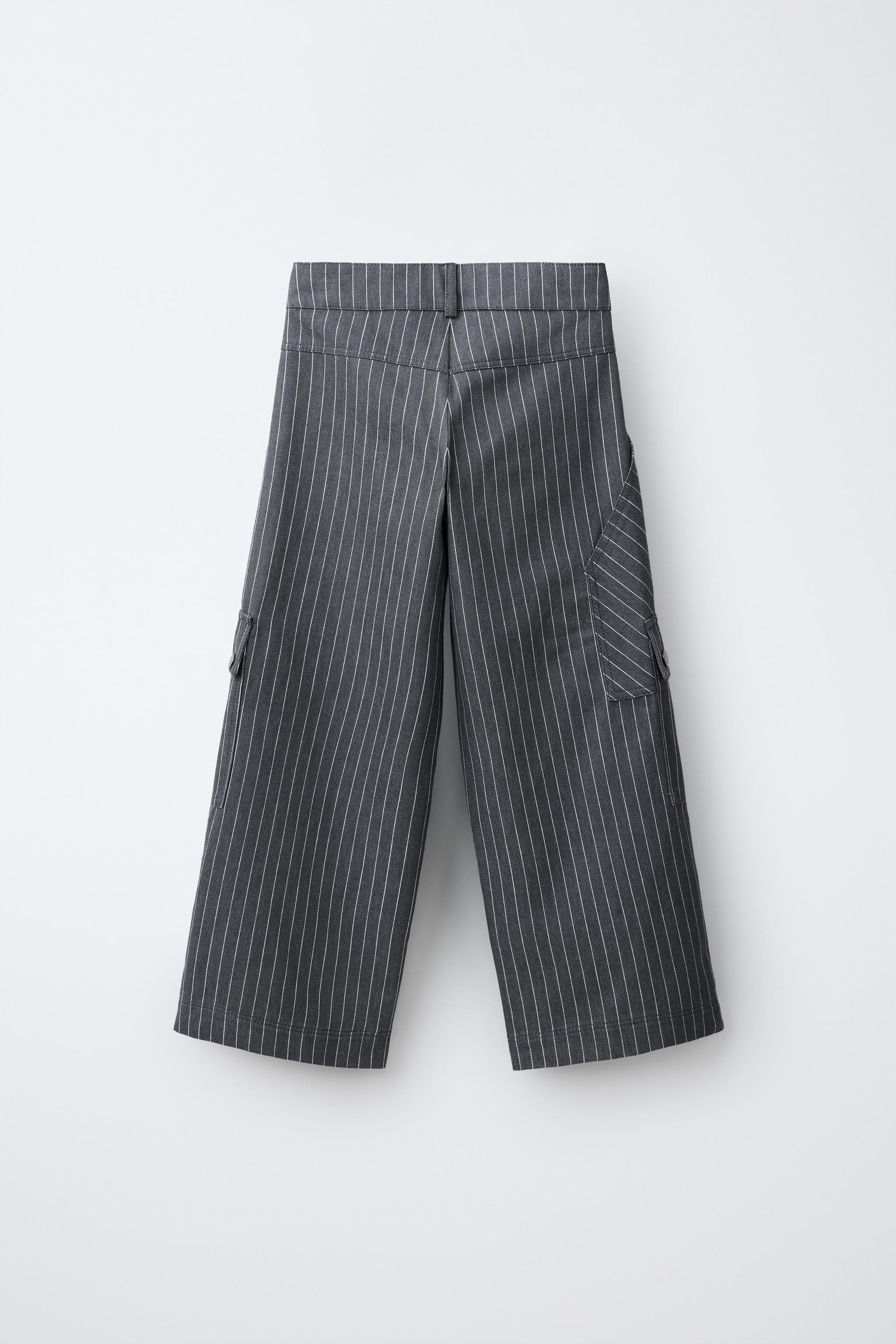 Carpenter-style pants with an adjustable inner waistband and front snap-button closure. Front poc... | Zara US