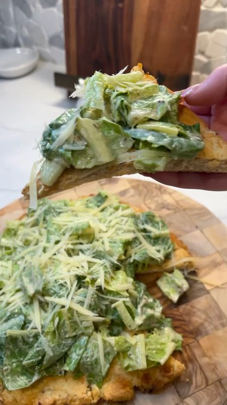 The VIRAL Cesar Salad Chicken Pizza 🥬

Ok we finally tried it and wow - pleasantly surprised!! Zero carb + high protein + super delish!

As always - all grocery items from HEB, everything else linked with recipe below: 

Pizza crust:
- 20 oz. canned chicken drained
- 1 large egg
- 2/3 cup provolone cheese
- 1 TSP garlic powder
- 1/2 TSP crushed red pepper flakes
- 2 TBS minced garlic

Salad:
- Romaine lettuce chopped
- your favorite Cesar dressing (I like a LOT of Cesar dressing to make sure each piece is coated)
- fresh grated Parmesan cheese

Instructions:
- Preheat your oven to 400 degrees and line a baking sheet with parchment paper. In a blender/food processor or large mixing bowl, add canned chicken. If in a bowl, mash the chicken into little bits so it’s no longer in chunks. Add in the egg, cheese, garlic powder, minced garlic, crushed red pepper flakes and mix together until well combined.
- Pour chicken mixture on the lined baking sheet. Using your hands or a silicone spatula, flatten the mixture and form a circle. Make sure to trace around the edge when flattened to prevent thin, burnt ends. 
Ours made about a 10-inch "pizza".
- Bake in the oven for 40 to 45 minutes, or until crispy and golden brown. When finished remove from the oven and allow to cool. 
- Spread about 2 TBS Cesar dressing onto the crust then cut into slices. I find it easier to cut before adding all the lettuce on top! 😉
- Top your pizza crust with salad and finish with your fresh Parmesan! Add a few more red paper flakes if you desire or sprinkle on some croutons if you love a good crunch. 

ENJOY 🥬💯🙌🏼


#LTKFitness #LTKHome
