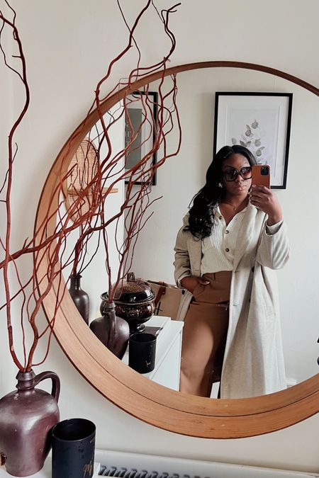Woman to woman… I hope you win this week sis! 💕

Casual Monday’s in some timeless wardrobe pieces!
Beige oversized long coat
Knitted cardigan with collar
Beige wide leg trousers
Black Hermes Kelly dupe
Neutral /white everyday  trainers 
Oversized wide face friendly shades
Touch of luxe ‘TOL’ in some pearl drop earrings