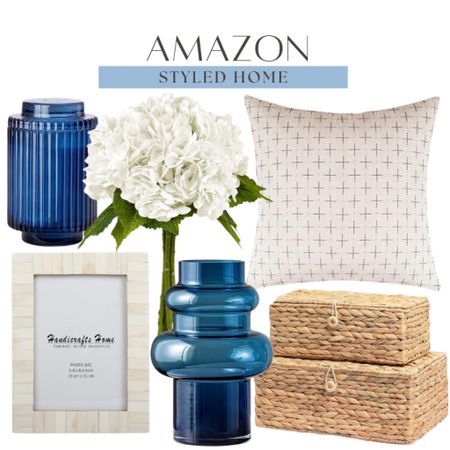 Amazon styled home includes rattan decorative boxes, blue vase, picture frame, throw pillow, hydrangeas, and candle.

Home decor, coastal decor, home finds, looks for less, home accents

#LTKFindsUnder50 #LTKHome #LTKStyleTip
