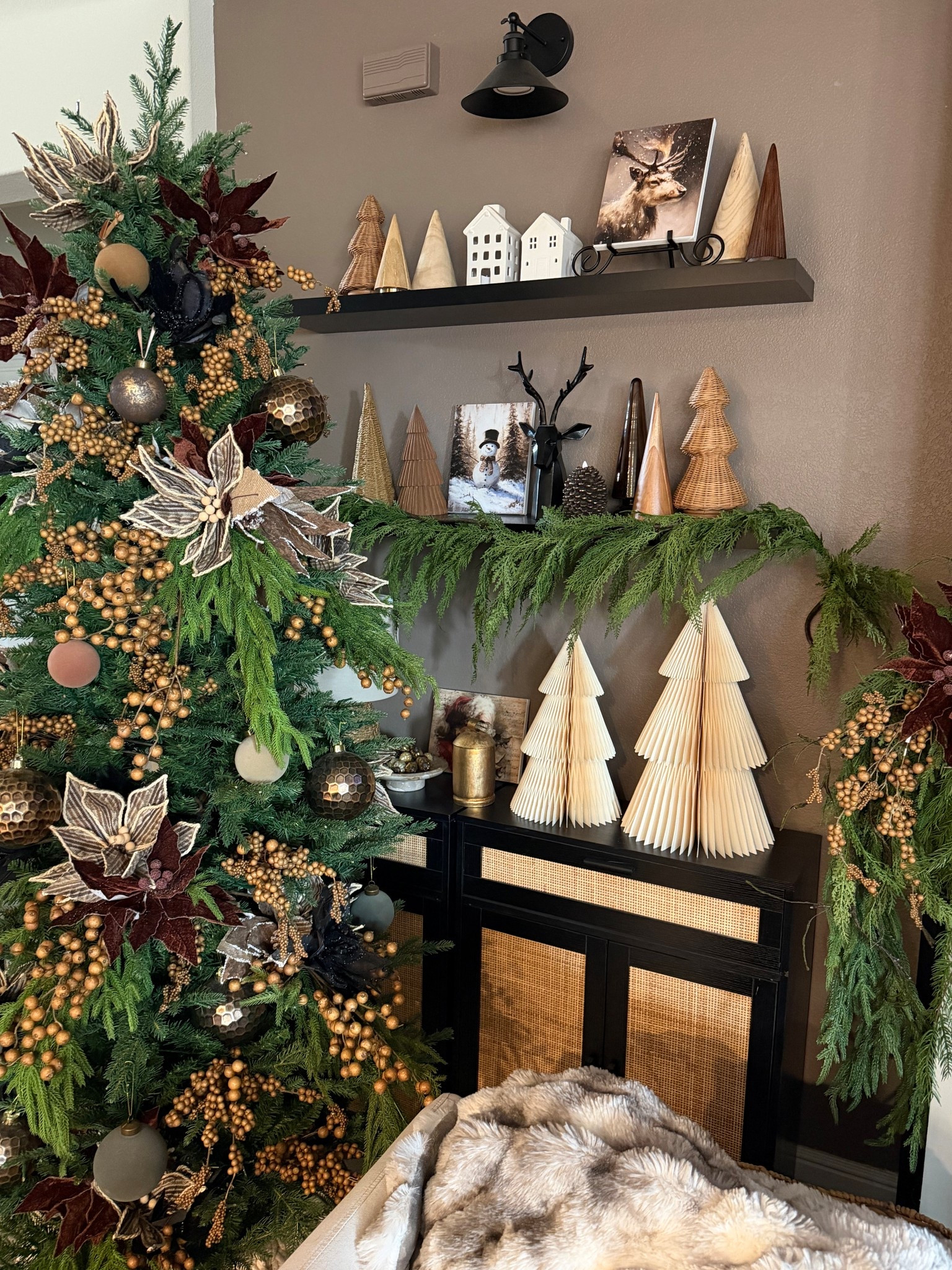 Christmas shelf styling inspiration- Christmas greenery, holiday garland, paper trees, Christmas village houses, table top Christmas trees 

#LTKHoliday #LTKHome #LTKSeasonal